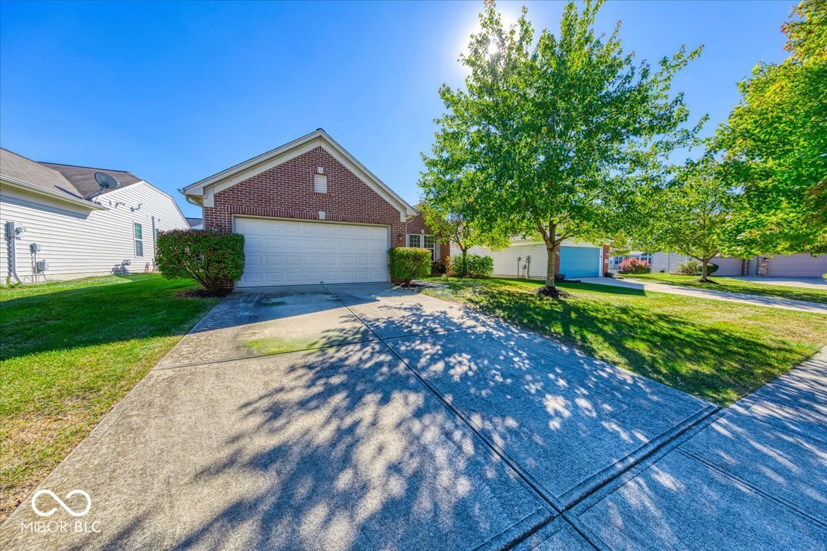 Nestled at 13935 Canonbury WAY, FISHERS, IN, this light-filled property in Hamilton County offers a wonderful residential opportunity. The single-family residence is in great condition. Fresh paint throughout and new carpet in the primary bedroom.  The heart of this home is undoubtedly the kitchen, featuring a large kitchen island that invites culinary creativity and conversation, shaker cabinets that offer a timeless aesthetic, and a double oven ready to handle any baking project; the backsplash provides an appealing contrast. The open floor plan allows this space to breathe and encourages interaction.  The primary bedroom serves as a private retreat, featuring an ensuite bathroom designed for relaxation and convenience. The bathroom boasts a double vanity, offering ample space, and a walk-in shower for a spa-like experience every day.  This single-story home, built in 2005, offers 1686 square feet of living area, set upon a 6970 square foot lot, and contains 2 full bathrooms and 2 bedrooms plus a den. Don't forget to enjoy the sunroom that overlooks the treelined backyard. This property offers a blend of comfort and style, all within a well-maintained single-family residence.  Furnace has been serviced on 10/17/2025.  2 HOA mgmt companies  Omni Management Services for Avalon of  Fishers- $89.00/month  Tried and True Association Management for individual neighborhood - $175.00/quarter