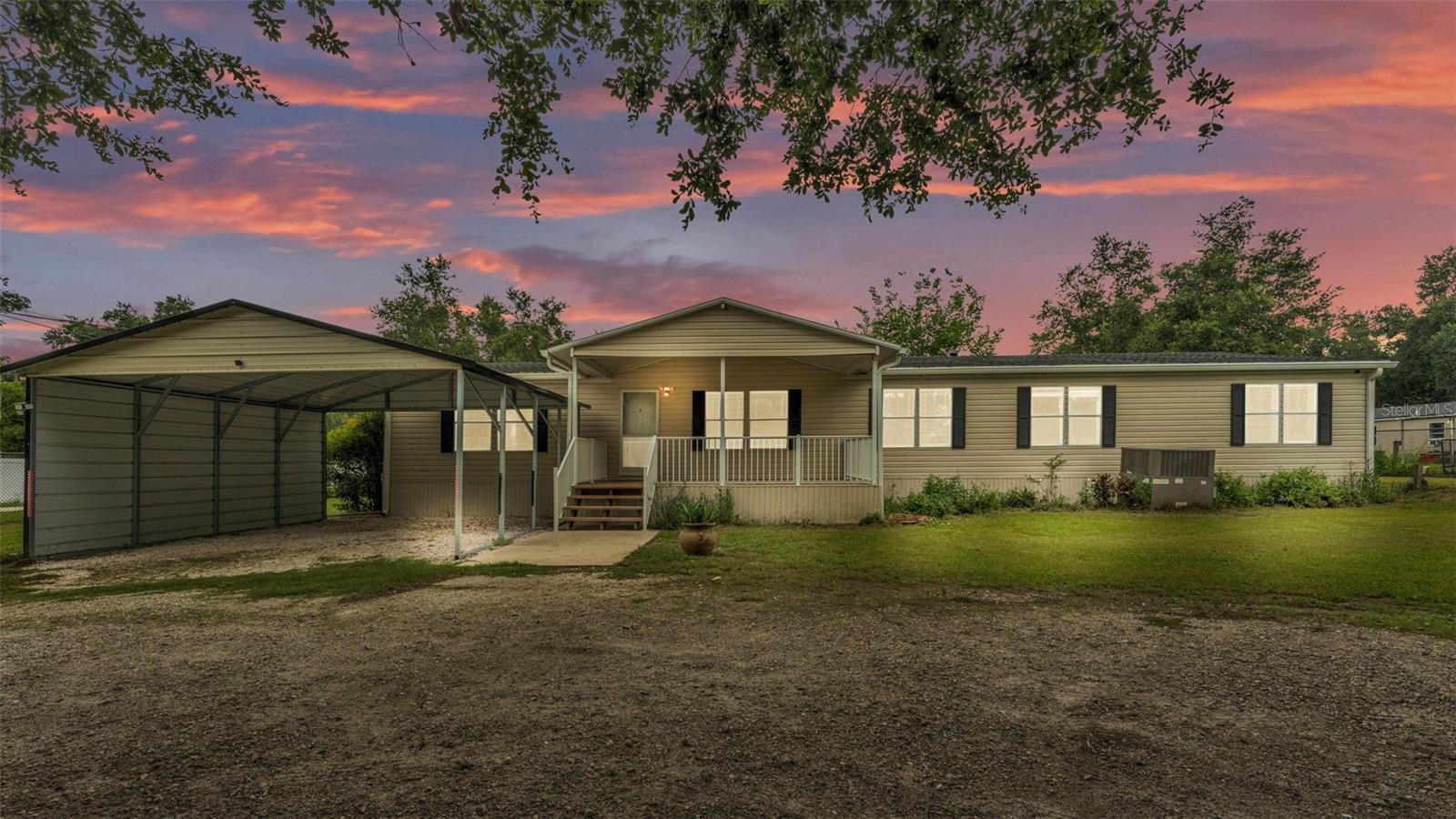 If you're looking for space, both inside and out, this Palm Harbor mobile home could be the one! Nestled on over an acre of fully fenced land, this spacious 4-bedroom, 2-bathroom home located in a desirable area in Plant City, Florida, boasts over 2200 square feet of living space, perfect for families and entertaining. The homes exterior showcases new vinyl siding, as well as a newly insulated covered front porch, and concrete steps, all installed last year. Step inside to find brand new interior paint throughout. The heart of the home is the modern kitchen, featuring a convenient bar area and all stainless-steel appliances. The layout also includes a designated dining area, living room, and family room, providing ample space for relaxation and gatherings. The master suite is a true retreat, complete with a large walk-in closet and an en-suite bathroom featuring a garden tub, shower, and dual sinks. Step outside to a spacious backyard with two large storage sheds, perfect for keeping your outdoor toys, boat, RV, gardening, or pool. With no HOA, this home offers both comfort and flexibility. Call today to schedule a private tour!