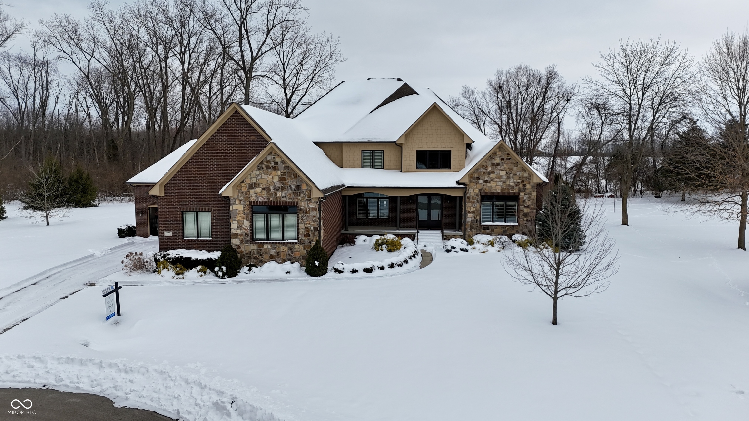 Back on the market and more impressive than ever!! This amazing luxury home is nestled in the prestigious gated community of Persimmon Woods and is ideal for modern living, with incredible space and design. The quality and craftmanship is apparent throughout, with 5 bedrooms (all with attached bathrooms), gourmet kitchen, full finished basement, large, gorgeous lot, inground pool, and 4 car garage, there is nothing left to be desired. The home opens into a two-story foyer with views of the large dining room and great room with views straight out to the sparkling pool and private lot with mature trees!  The home office, off the foyer, is truly the best, with nearly 60K in updates in the last year (gorgeous built-in cabinets and granite counters).  Moving from the front through the dining and living area and into the beautiful kitchen, the pride-in-ownership is evident with detailed trim work, built-in bookshelves and arched doorways. The chef's kitchen does not disappoint, with endless cabinets and granite counter space, gas range and hood, double built-in ovens and a large pantry. The large main floor primary bedroom is the perfect retreat, with patio access, attached bath featuring double vanities, garden tub with separate shower, and mammoth walk-in closet. The main floor is finished out with incredible mud room space, entered into from both garages, with half bath, access to the laundry, and plenty of storage space. Upstairs you'll find three well appointed bedrooms, all with attached bathrooms and large bonus room, perfect for gaming or movies!  The finished basement with daylight windows provides all the space needed with the same level of quality as the rest of the house - living area, game area, bar, large bedroom with attached nook and full bathroom, exercise room, and plenty of storage! The large tree-lined lot provides plenty of privacy, and plenty of opportunities for fun with the inground pool, hot tub, covered patio and open grass areas!