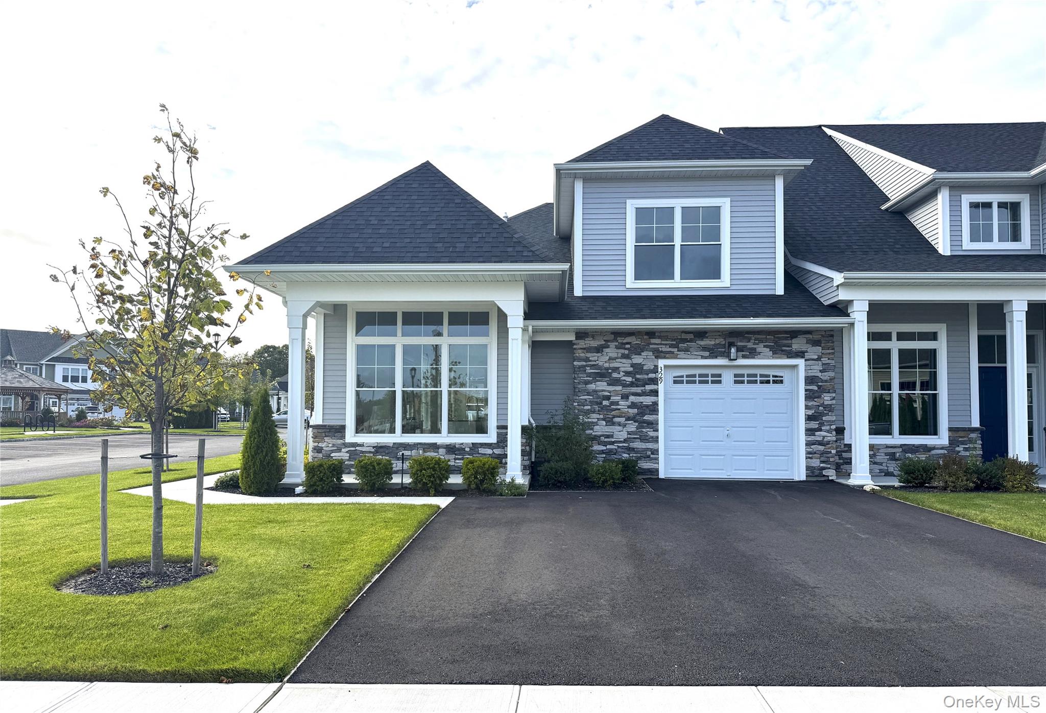 Welcome to Country Pointe Meadows, where modern elegance and timeless comfort meet in this beautifully designed end-unit townhome. New construction by Beechwood Homes, this residence features 2 bedrooms plus a den, 2.5 bathrooms, a loft, unfinished basement, and an oversized one-car garage. Designed with top-of-the-line appliances and high-end finishes, this home offers the perfect balance of style and sophistication.The vaulted ceilings and open-concept layout create a bright, airy atmosphere ideal for both entertaining and relaxing. The great room flows effortlessly into the living and dining areas, while the gourmet kitchen impresses with a large center island, custom cabinetry, and designer details. The adjoining breakfast area with its 12-foot ceiling enhances the home’s open feel, leading to a private patio perfect for outdoor gatherings.The first-floor primary suite serves as a peaceful retreat, complete with dual closets and a spa-inspired bath featuring a double vanity and elegant finishes. Upstairs, the loft offers flexible living space, the second bedroom provides comfort for guests, and the den can serve as a media room, office, or fitness area. A laundry room and unfinished basement add convenience and future potential.Enjoy outstanding community amenities including a clubhouse, snow removal, and a manned gatehouse. Relax by two heated pools with sundeck and cabanas, stay active in the fitness center, or play on the bocce or tennis courts. Socialize at indoor and outdoor bars, barbecues, and firepits, or watch sports in the lounge.Ideally located near world-class golf courses, county biking trails, and The Boulevard’s retail center with shopping, dining, healthcare, and entertainment options, this home offers the ultimate in luxury and lifestyle.Sale may be subject to terms and conditions of an offering plan. Buy directly from the builder with a 1-year warranty included. Furniture sold separately.