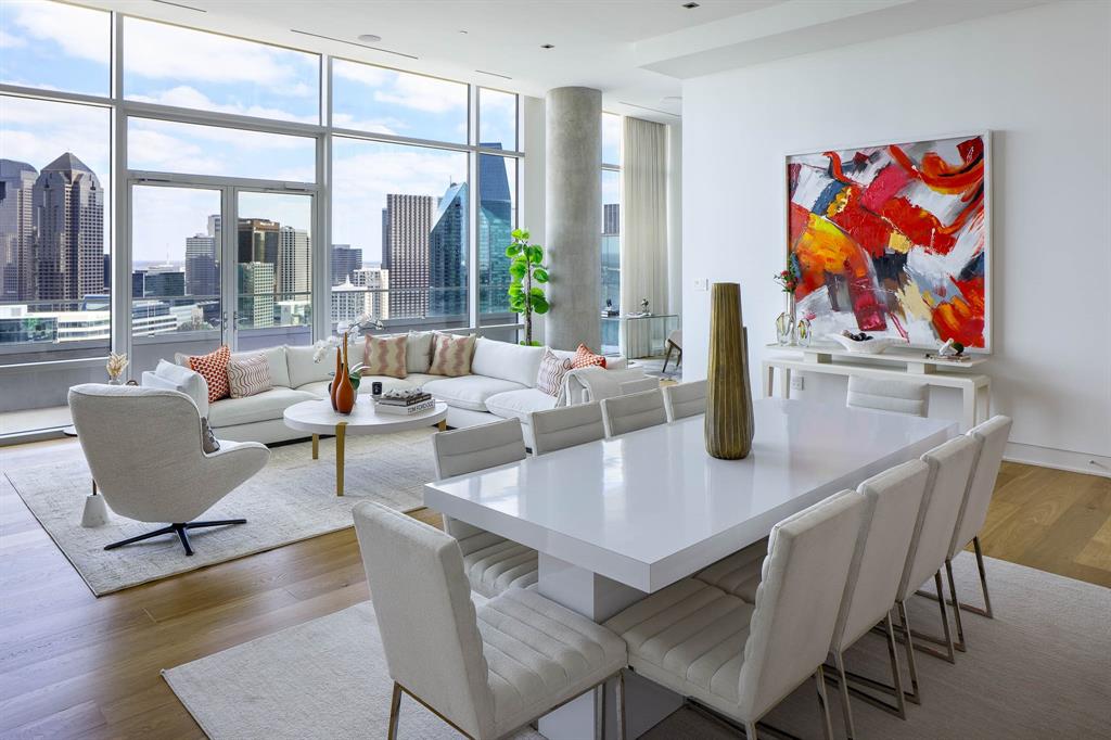 Perched high above the city at the iconic W Dallas – Victory, this custom-designed Penthouse offers a rare blend of modern glamour and effortless sophistication. Framed by dramatic downtown skyline views, the expansive private terrace becomes a true extension of the living space — perfect for sunset cocktails or intimate evenings overlooking the city lights.Inside, soaring 13-foot ceilings and walls of glass create an airy, light-filled atmosphere. The thoughtfully imagined two-bedroom layout includes a separate office area, ideal for working in style. Designer finishes elevate every space, from the striking marble-surround fireplace anchoring the living room to the spa-inspired white marble baths. A massive custom closet delivers boutique-level storage, while every detail reflects elevated penthouse living.Residents enjoy world-class Marriott hotel services including valet, concierge, onsite dining, spa services, state-of-the-art fitness center, and resort-style pool — delivering lock-and-leave convenience with uncompromising luxury.A true statement residence in the sky.