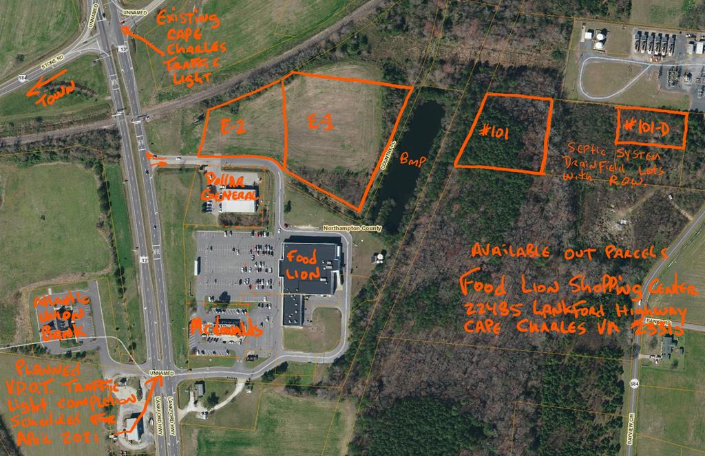 Two Cape Charles Food Lion shopping center lots across the driveway from Dollar General, with direct access to the new traffic light through the shopping center, and a highway entrance/exit adjoining Tract 2 provides easy traffic flow into the property directly from the highway. "Tract 1, Lot E" is the rear lot adjoining the Railroad tracks on the North, the storm water pond for the center on the East, the main driveway on the South contains 4.00 acres, and is adjoining Tract 2. Parcel E, has 1.31 acres, and fronts on the VDOT highway ROW, the railroad tracks on the North, and the driveway on the South.  Two additional "remote drain field lots" lots are included with an additional 2.53 acres, being lots #101 and #101D on the far side of the storm water pond, with access easements.