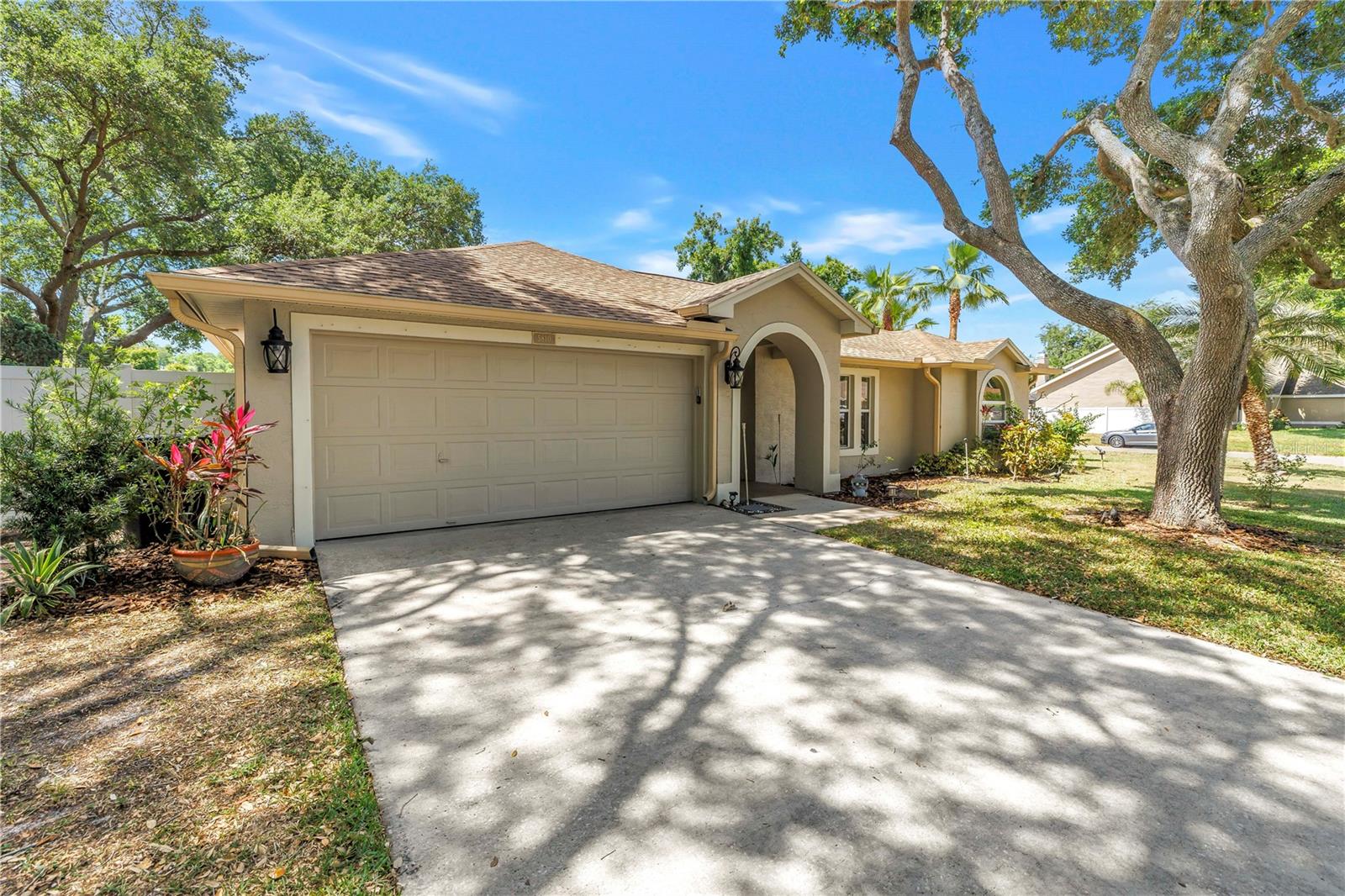 Welcome to this beautiful 3 bedroom, 2 bath home with a 2 car garage, tucked away on a quiet street in the established Mandarin Lakes community. Situated on an oversized corner lot shaded by mature trees, this property offers privacy, space, and a setting that feels both peaceful and inviting.Inside, the thoughtfully designed 1,670 square feet of living space is perfect for everyday living and effortless entertaining. A spacious living and dining area opens the home, complemented by durable ceramic tile flooring throughout the main living areas. The centrally located kitchen overlooks the family room, creating a natural gathering space ideal for hosting or relaxing at home. Vaulted ceilings enhance the open feel, while a skylight added in 2022 fills the living area with warm, natural light. White cabinetry with integrated lighting, paired with a complete appliance package—including refrigerator, range, dishwasher, and washer/dryer—makes this kitchen as practical as it is welcoming.Significant recent upgrades provide peace of mind for years to come. The home features a 2022 architectural shingle roof with reinforced trusses treated with a professional grade epoxy sealant for enhanced wind protection, along with a brand new HVAC system installed in 2026. Additional improvements include a water softener, updated lighting, and ceiling fans throughout.Step outside to the screened back porch, where you can enjoy morning coffee or unwind in the evenings while overlooking the well kept, private fenced-in backyard—an ideal extension of the living space.The primary suite is privately positioned on one side of the home and offers a large walk in closet and an updated en suite bath featuring an oversized walk in shower, extended vanity, and stone accents. Two additional bedrooms are located on the opposite side of the home in a desirable split-floor plan and share a fully updated bathroom with modern tiles and finishes.Well maintained, thoughtfully upgraded, and ideally located, this home delivers comfort, functionality, and lasting value—an exceptional opportunity at this price point.