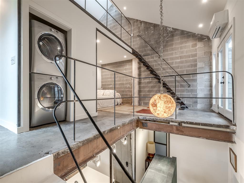 Striking Industrial Tri-Level in SoSA — A Rare Design Statement. This fully remodeled 2 bed, 2 bath tri-level condo delivers a bold, minimalist industrial aesthetic rarely found in this price range — exposed concrete, steel, and brick construction paired with custom finishes throughout. Three private balconies, an open-concept main level, and a stunning kitchen with a large, versatile island, custom backsplash, and stainless steel appliances flow seamlessly into the living and dining space. Upstairs, both bedrooms enjoy their own private balcony; the primary suite features a spacious walk-in closet, a fully renovated bath with penny tile, Moroccan plaster, and an oversized shower, plus a balcony with views of the year-round pool below. A flexible third-floor loft offers space for a home office, gym, or optional third bedroom. Basement-level, gated underground parking includes two reserved spaces for the owner — a rare convenience and added security. Resort-style amenities include the pool and clubhouse just steps away, plus a handful of standout restaurants and bars nearby. Positioned in the SoSA community,  one of OKC's fastest-appreciating neighborhoods; a compelling opportunity for a buyer. Unit is occupied - proof of funds required prior to scheduling any showing.