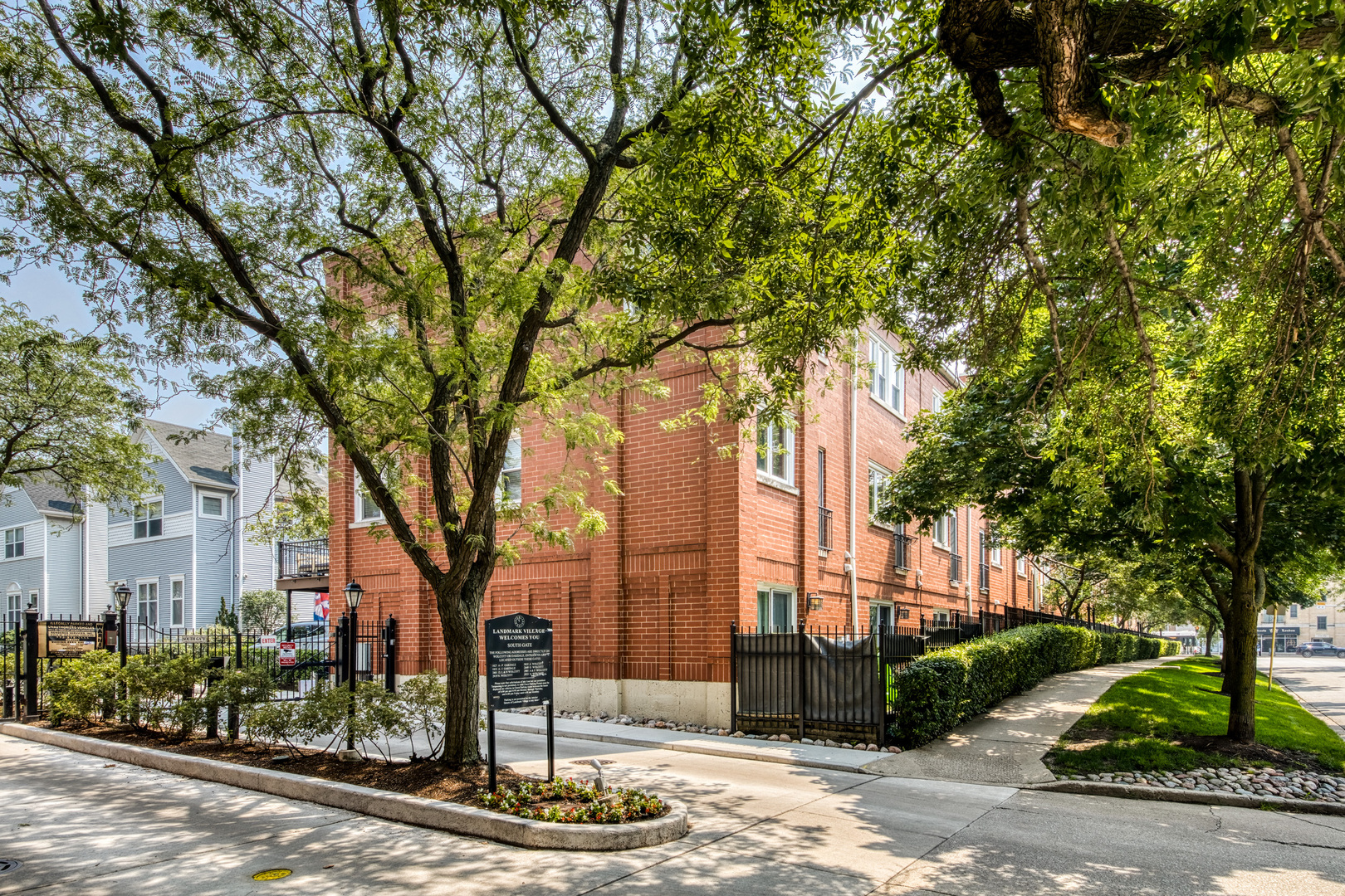 Welcome to this beautifully updated 2-bedroom townhome nestled in a sought-after gated community in West Lakeview. Enjoy abundant east and west natural light throughout the home, enhancing its warm and inviting feel.  The expansive main level features a sun-filled living room with a cozy corner fireplace. Step outside to a generous private deck, perfect for summer gatherings or morning coffee/evening peaceful retreats. The open-concept layout includes a dedicated dining area, a convenient half bath, and a spacious kitchen with stainless steel appliances, ample cabinetry, and generous counter space.  Upstairs, a stunning skylight welcomes you to the top floor, where you'll find a large primary bedroom, a comfortable second bedroom, and a well-appointed full bathroom with double vanity. Brand-new in-unit laundry adds modern convenience.  Enjoy the benefits of attached private garage parking to escape the Chicago elements. Located just steps from two beautiful parks, public transit, and everything West Lakeview has to offer.  Don't miss this rare opportunity to own in a gated community in one of Chicago's most desirable neighborhoods!
