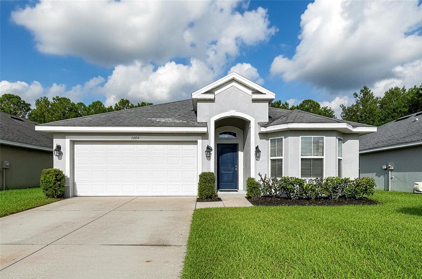 7029 Wirevine Drive, a single-story home in the Sherman Hills community of Brooksville, Florida, offering golf course views, aging in place accessibility features, low community fees, and a private screened outdoor retreat.This 3 bedroom, 2 bath home offers approximately 1,505 square feet of living space with several features designed to support comfortable, accessible living. Seamlessly integrated concrete ramps provide smooth transitions into the home and are ideal for wheelchairs, walkers, strollers, rolling luggage, and everyday convenience. The primary bathroom includes a grab bar in the shower and an additional support bar beside the toilet, adding practical aging-in-place functionality.The screened rear patio is a standout feature of the property. With no neighboring homes directly behind the residence, the outdoor living area overlooks the Sherman Hills Golf Course and faces west, perfect for enjoying Florida sunsets and the open golf course landscape.Within the screened enclosure is a private water feature that has previously been used as a therapy pool. Approximately five feet deep and mostly recessed into the ground, the square pool rises only about one foot above the surrounding concrete patio and includes spa-style jets in one corner. Its size and configuration also lend themselves well to use as a cocktail pool or plunge pool, providing a private place for aquatic exercise, relaxation, or cooling off during Florida's warmer months. This section of Sherman Hills also offers the benefit of a low annual HOA fee and no CDD fee. The property does not include access to a community clubhouse or community swimming pool, helping keep recurring association costs lower. With a private screened outdoor living area and cocktail-style therapy pool at the residence, homeowners can enjoy their own recreational space while avoiding the higher fees often associated with amenity-rich communities.Sherman Hills Golf Club is an 18-hole public golf course known for its rolling terrain, elevated areas, mature oak trees, and landscape that is notably different from many traditional Florida courses. Because the course is open to the public, golf enthusiasts can enjoy convenient access without the expense of a bundled private golf membership.The location combines a quieter, more rural setting with convenient access to everyday necessities. Interstate 75 is just a few miles away, providing convenient north-south travel throughout West Central Florida, while shopping, dining, and services are available along the nearby State Road 50 corridor.  The nearby Croom Tract of Withlacoochee State Forest offers thousands of acres for hiking, biking, horseback riding, camping and wildlife viewing. Silver Lake Recreation Area provides opportunities for kayaking, canoeing, boating and fishing, while the 47-mile paved Withlacoochee State Trail is popular for cycling, walking and running. For off-road enthusiasts, the Croom Motorcycle Area offers 2,600 acres of designated motorcycle and ATV trails.Downtown Brookeville and Dade City are also within a short drive, offering locally owned restaurants, boutiques, coffee shops, historic architecture, and the charm of one of the area's best-known small downtown districts.