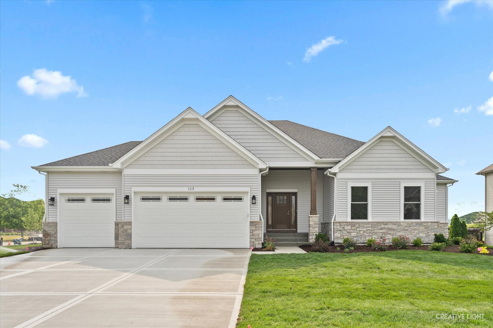 This sprawling three bedroom under construction ranch house is ready for you to customize! There is still time to make your selections! Open one story floor plan provides plenty of living space - dining room/office with barn doors that open to the kitchen, large family room with beamed ceiling and limestone fireplace, kitchen with huge island and separate eating area and three bedrooms. Kitchen has been updated to a chef's dream - custom cabinetry, island with plenty of prep space and seating and stainless steel appliances. Private master suite with oversized walk in shower, separate toilet closet and dual vanity. Two additional bedrooms (or use one as a home office, den or yoga space) - one en suite with full bathroom and large closet. Large basement with rough in bathroom that could be completed to add additional living space, bedroom and/or exercise room. Laundry room conveniently located off of the garage with built in lockers/bench and extra closet storage. Three car garage. Builder financing is available. Pricing is subject to change based on current cost estimates. Photos of previously built home in Deerpath Trails. Move in by next summer - JUNE 2026 delivery. There is time to make your selections and the builder standards exceed others options.