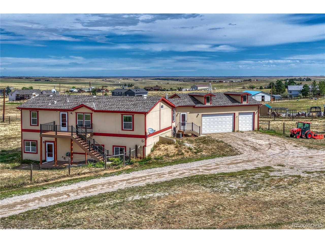 ** 5-BEDROOM RANCH | 4 ACRES | FULLY FINISHED WALKOUT BASEMENT | 3-CAR ATTACHED GARAGE + EXTRA PARKING | MOUNTAIN VIEWS **PRICED TO SELL! Freshly updated with brand-new carpet and pad plus fresh interior paint, this spacious ranch-style home offers the space, flexibility, and land buyers have been looking for. Set on 4 acres with a fully fenced pasture area, this property provides room to spread out while offering the convenience of one-level living.The main level features 4 bedrooms and 2 full bathrooms, along with a central kitchen that opens to the living and breakfast nook areas-creating a comfortable, functional layout for everyday living and entertaining. Step outside onto the mountain-facing composite front deck, an inviting spot for morning coffee, outdoor dining, grilling, entertaining, or simply enjoying the views.The fully finished walkout basement adds an impressive second living area with a large open living/recreation space, wood-burning stove, guest bathroom, and a private bedroom suite. The walkout bedroom features a full bathroom with dual vanities and a walk-in closet, making the basement ideal for guests, extended family, teenagers, a home office, recreation space, or a separate living arrangement. Both basement safes are included.The 3-car attached garage includes extensive storage cabinets, while the property offers plenty of additional parking for vehicles, trailers, recreational equipment, or guests. Additional features include central A/C, domestic well, and a fully fenced pasture area.Whether you're looking for acreage, room for a growing family, space for guests or multigenerational living, or simply more room to enjoy the Colorado lifestyle, this property delivers space, flexibility, and value at an attractive price.TRACTOR AND ACCESSORIES ARE AVAILABLE FOR SALE SEPARATELY.
