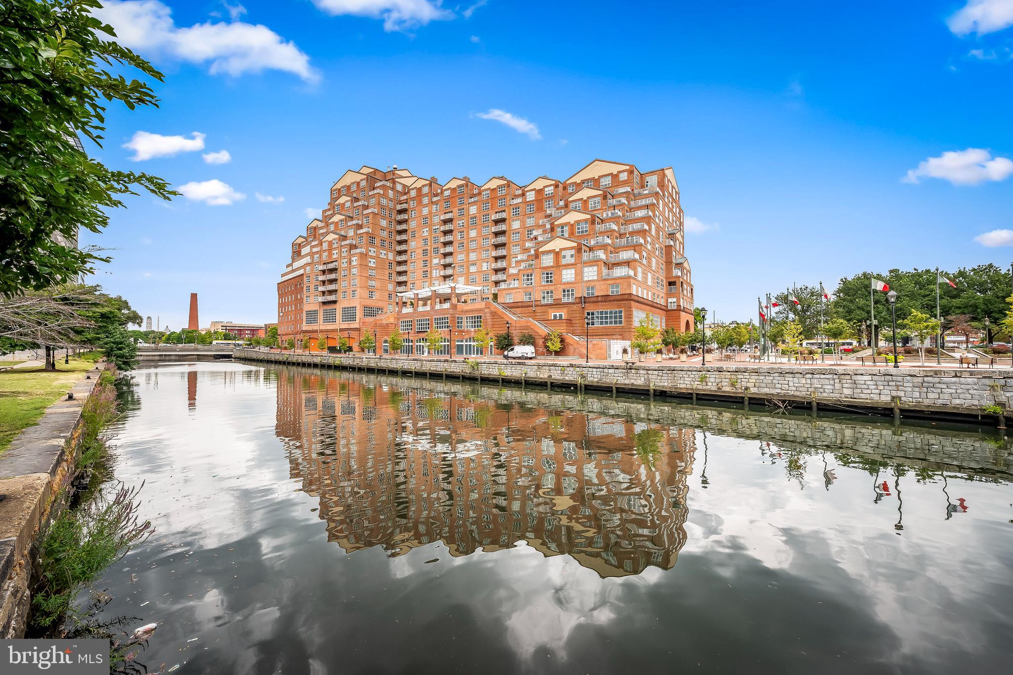 Welcome to Scarlett Place—where city living meets comfort and style! This beautifully updated 2-bedroom, 2-bath condo offers stunning city views and glimpses of the water from the building. Ideally located just moments from Harbor East, Pier Six, and an abundance of top-rated restaurants, shopping, and city attractions, this is urban living at its finest.Step inside to discover a thoughtfully renovated interior featuring luxury LVP flooring throughout and an inviting private balcony with retractable screen doors—perfect for enjoying fresh air year-round.The fully renovated kitchen is a standout, boasting granite countertops, new tile flooring, and all-new appliances—ideal for both everyday living and entertaining. Both bathrooms have been completely updated with modern finishes, including ceramic tile, new vanities, countertops, sinks, and fixtures. The primary bath features a spacious 6-foot soaking tub with built-in storage for added convenience, while the hall bath offers a sleek walk-in shower.Additional highlights include a washer/dryer combo in-unit, operable windows with screens in every room, and one assigned garage parking space and extra storage unit on floor. Enjoy a full suite of amenities including a secure front desk, elevator access, indoor pool, grilling area, fitness center, and beautifully maintained common areas.Even better—the current owners have loved living here so much that they’re simply moving within the building, a true testament to the lifestyle and community at Scarlett Place!Move-in ready and packed with upgrades—this is city condo living at its best!