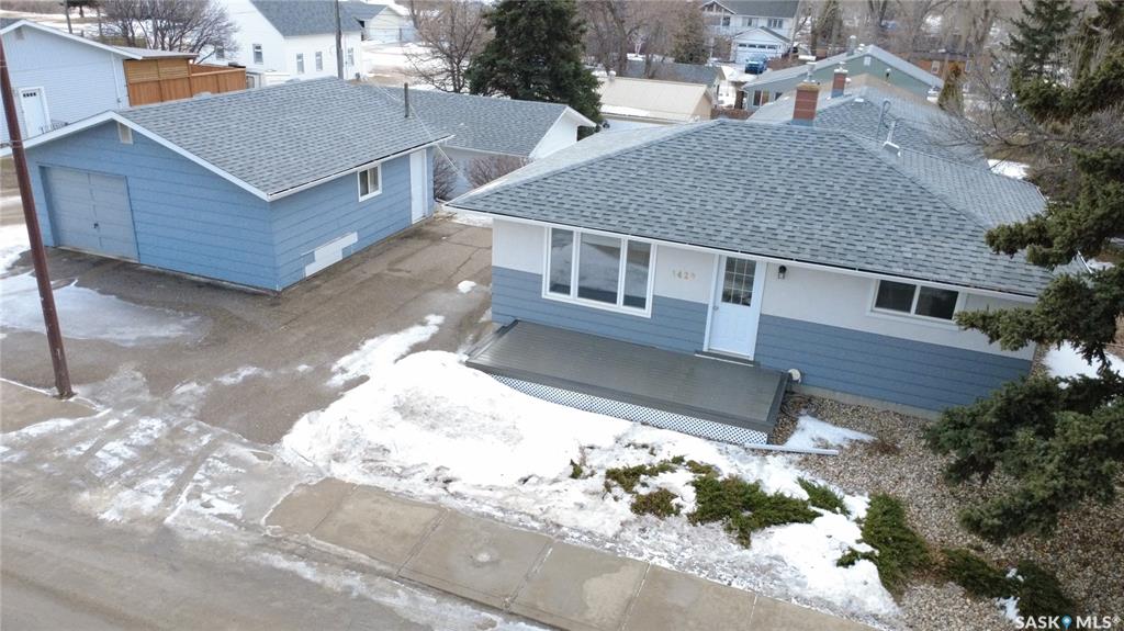 Affordability just got a new address – 1420 Chaplin St. E., Swift Current. Priced at just $238,000, this stylishly renovated 2+1-bedroom, 2-bathroom home proves you don’t need excess square footage to live comfortably or look good doing it. The smart 768 sq.ft. layout eliminates wasted hallways and maximizes every inch. The modern kitchen features sleek melamine cabinetry, stainless steel appliances, and flows seamlessly into a bright, welcoming living room. Both main-floor bedrooms offer comfortable proportions and a spa-worthy 4-piece bath with eye-catching tile and tub surround that truly shines. Downstairs, the rec room is dressed up with trendy barn doors leading to the laundry and utility area, a third bedroom, and a sharp 3-piece bathroom, making it ideal for guests, teens, or movie marathons. Outside, the 24x24 garage is a rare find with half dedicated to parking and half to a fully powered workshop with sub-panel and 220 plug, plus extra parking space for vehicles, toys, or that RV you use every weekend. Add in PVC windows, a 200-amp panel, a high-efficiency furnace, and numerous other updates, and this home delivers big value without the big price tag—proof that good things really do come in well-renovated packages.