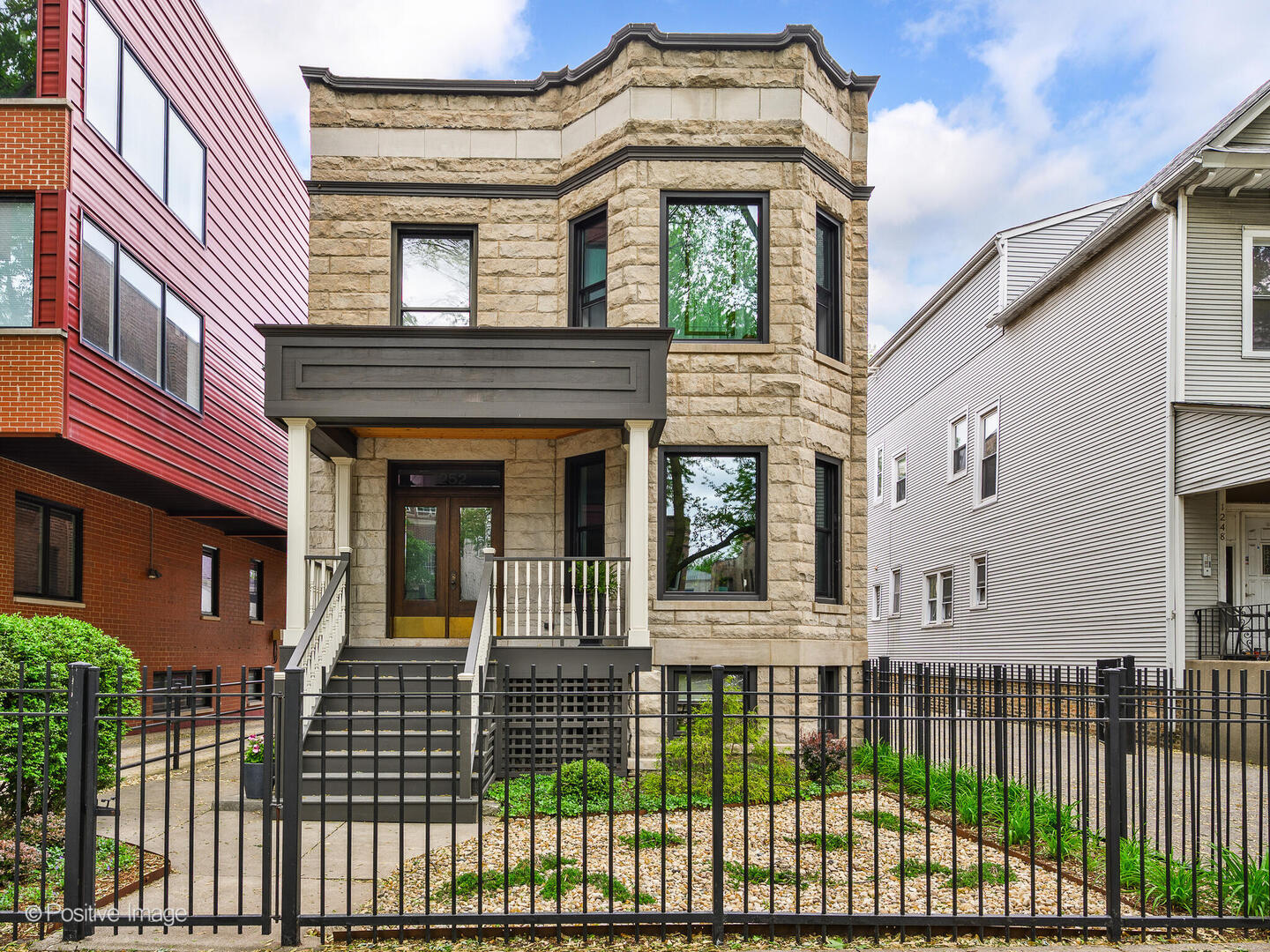 Welcome to 1252 W Carmen Avenue, a beautifully renovated Greystone situated on an oversized lot on a quiet, tree-lined street in Andersonville, offering convenient access to the shops, dining, and cultural destinations of Andersonville and Broadway. Sitting on a rare 40' x 150' lot with no alley behind it, the spacious backyard is truly a peaceful oasis in the city providing a unique, private setting in Andersonville. This tranquil reprise is ideal for slow mornings enjoying a cup of coffee, cultivating your favorite vegetables in your raised-bed garden, or fun evenings spent with family and friends.    Originally renovated in 2018, this spacious home delivers a perfect blend of architectural charm, modern updates, and flexible living space across three thoughtfully designed levels. A professionally landscaped front yard welcomes you into a gracious foyer and a flowing main level featuring a formal living room with a gas fireplace, an expansive dining area, and a high-end kitchen with commercial-grade stainless steel appliances, quartz countertops, and a large island. Just off the kitchen, an oversized family room opens onto a large back deck overlooking a serene, landscaped yard with perennial praire flowers and raised vegetable garden boxes. A powder room and laundry room complete the first floor.    Upstairs, the second level offers four generously sized bedrooms and three full bathrooms. The south-facing primary suite includes a walk-in closet and an en-suite bath with dual vanities, a soaking tub, and a walk-in shower. The additional bedrooms feature ample natural light and storage, with a second laundry hookup in the hallway.    The lower level, completed in 2022, has been fully finished to include a separate 2-bedroom, 1-bath unit with a private entrance. The lower level boasts outstanding natural light and is complete with a full, spacious kitchen, heated bathroom floor, and dedicated laundry. Enjoy the serene private outdoor space that overlooks the perennial garden. This flexible space is ideal for a variety of living arrangements, offering options for guest accommodations, multi-generational living, additional household support, or as additional income.    Be a part of the thriving Winona Foster Carmen Winnemac (WFCW) Block Club community when you call 1252 W Carmen Ave home.
