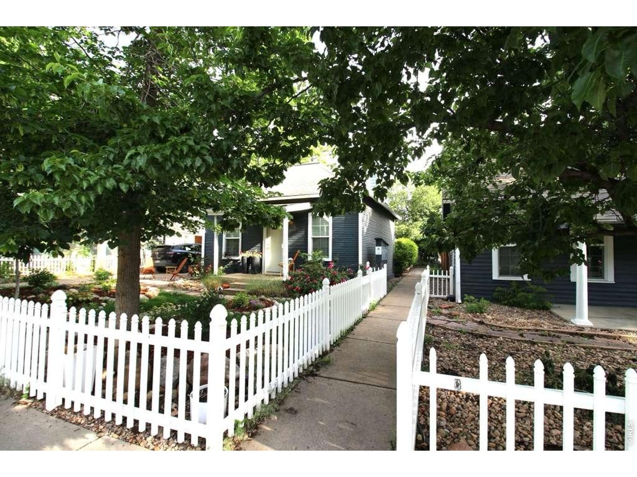 Enjoy the ease of townhome living with no neighbors above or below, just steps from Pearl Street in one of Boulder's most walkable locations. Quietly tucked off the street yet moments from Pearl Street Mall, dining, coffee shops, and boutiques, this home offers a rare blend of privacy, walkability, and easy everyday living in the heart of Boulder. The flexible floor plan includes a third bedroom ideal for a guest room, home office, or additional living space. Inside, you'll find hardwood floors, a fireplace, stainless steel appliances, and in-unit laundry with washer and dryer. A reserved outdoor parking space is included, along with a dedicated outdoor sitting area. Cozy, functional, and move-in ready, with the opportunity to personalize over time in a highly sought-after central Boulder location.