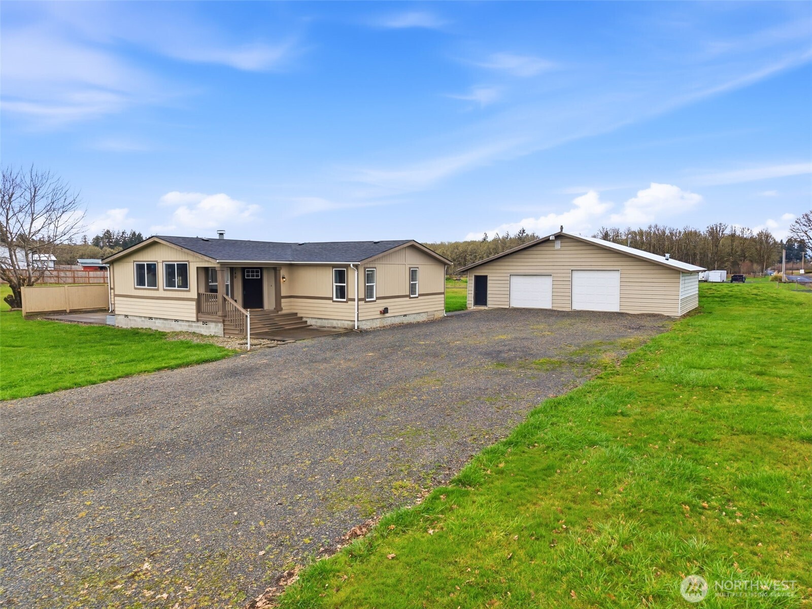 Discover the perfect blend of privacy and potential on this nearly 2 acre property in Toledo. Offering a rare combination of high-bank Cowlitz River views, unobstructed views of Mt. St. Helens and Mt. Rainier. The property features a spacious 1,950 sq. ft. triple-wide manufactured home with an open-concept 3-bedroom, 2-bathroom layout, alongside a substantial 30x40 insulated shop equipped with its own power service and concrete floors.  Home includes a bonus living space with a large TV that stays with the home and an office space. Home was recently remodeled. Remodel includes updated kitchen, new flooring, new windows, paint inside and out, new sinks and faucets, new water heater, and newer roof. Come experience the stunning mountain and river views this home has to offer, and jump on this rare opportunity before it is gone! Due to recent boundary line adjustment, map is incorrect. Please refer to plat map provided in supplements.