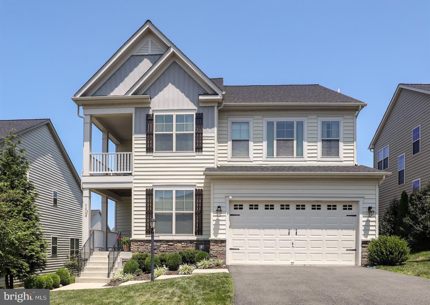 Move right into this beautifully maintained home in the highly desirable Broadlands community, where timeless design, quality updates, and an exceptional location come together. Nestled on a quiet street, this home offers the perfect balance of elegance, comfort, and everyday functionality.The open floor plan is filled with natural light and showcases rich hardwood flooring, custom trim, designer lighting, custom blinds, and thoughtful finishes throughout. At the center of the home is a stunning chef's kitchen featuring white cabinetry, upgraded granite countertops, stainless steel appliances, a gas cooktop, and a butler's pantry that connects seamlessly to both the formal and casual living spaces—perfect for entertaining or everyday living.The upper level offers four spacious bedrooms and three full bathrooms, including a luxurious owner's suite designed for comfort and privacy. The finished lower level provides incredible flexibility with a large recreation room, a fifth bedroom, a full bathroom, and space ideal for guests, a home office, gym, or multi-generational living.Step outside and enjoy three inviting porches, including a screened porch overlooking a private backyard surrounded by mature trees. Whether you're enjoying your morning coffee or hosting family and friends, this outdoor space is sure to become a favorite.Major updates provide peace of mind, including a new roof (2021), HVAC systems (2019 & 2021), water heater (2025), and a pre-wired EV charging outlet in the garage.Broadlands is one of Loudoun County's most sought-after communities, offering miles of walking trails, neighborhood pools, parks, playgrounds, sports courts, and community events. Just minutes away are Beaverdam Reservoir, Brambleton Regional Park Golf Course, the Ashburn Recreation & Community Center, Brambleton Town Center, One Loudoun, and Ashburn Metro. Conveniently located within the highly acclaimed Waxpool Elementary, Eagle Ridge Middle, and Briar Woods High School pyramid, this home truly offers the complete Northern Virginia lifestyle.