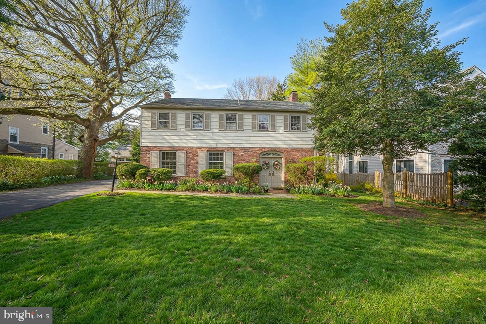 Immaculate four bedroom center hall brick Colonial in one of the Main Line's most beloved 'walk-to' neighborhoods. Private driveway with custom brick walk to front portico and double front doors. Gracious center entrance foyer with powder room and coat closet. Formal reception rooms, updated lighting plan and pretty hardwood floors.  Large living room has bright, front facing windows, dining room has chair rail and sunny window wall overlooking the private rear patio and garden. Large and nicely redone eat-in kitchen opens to step-down family room with brick fireplace and back door to rear, brick patio, detached two car garage and fenced, level rear yard.  Full, unfinished lower level with separate outdoor egress.Quiet leafy streets with sidewalks and street lights, beautiful houses, both a preservation meadow and a community garden serve the neighbors.  Proximal to LMHS's athletic fields, tennis courts and track, all just up the street. Ardmore's Suburban Square plus short walk to SEPTA and to Narberth!
