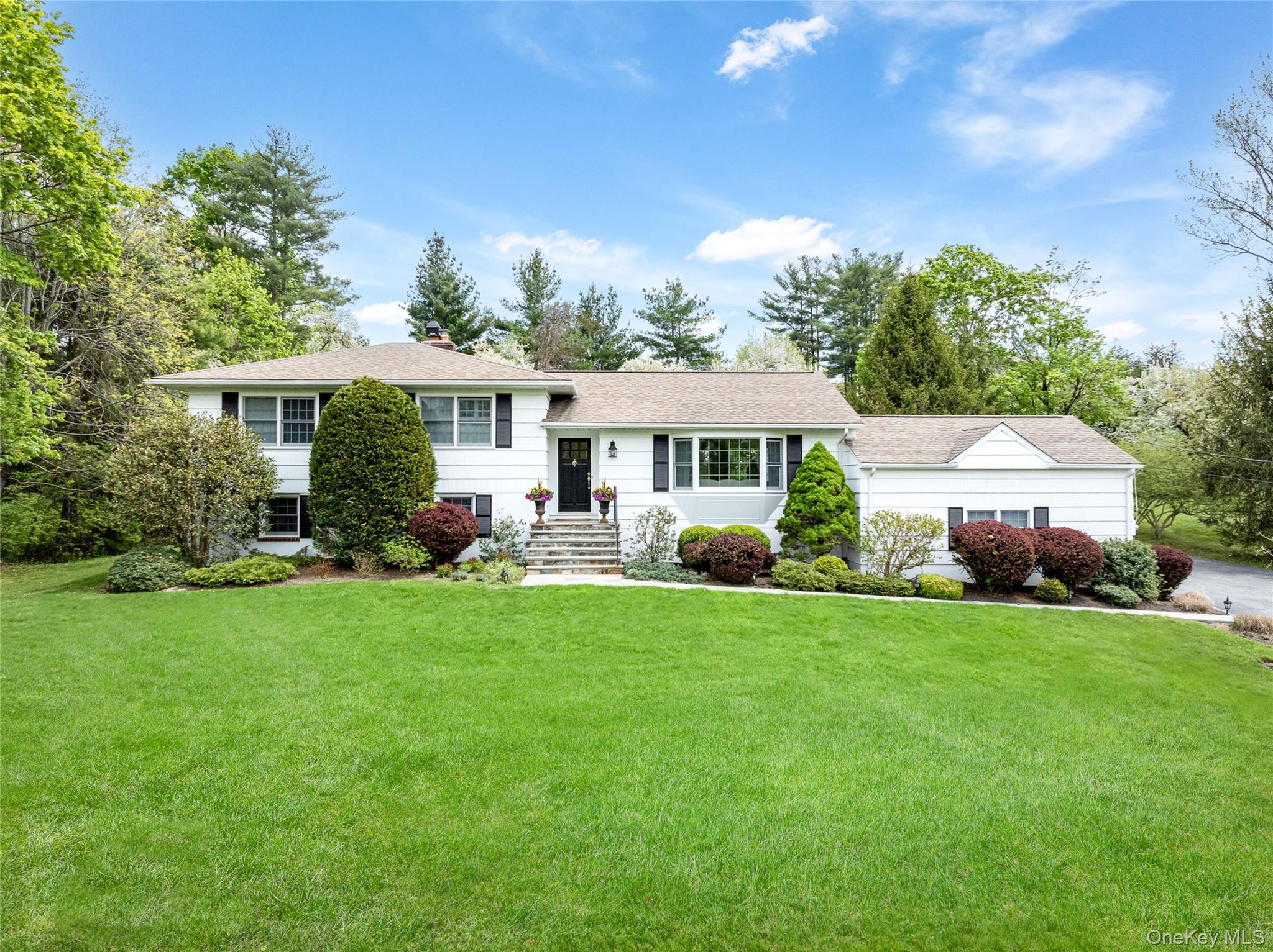 Welcome to this pristine, move-in ready home in the highly sought-after Windmill Farms community! Impeccably maintained and renovated throughout, this residence offers over 3,000 square feet of thoughtfully designed living space. The home features a bright, open floor plan creating a warm and inviting environemnt. Spacious, sun-filled rooms, seamless flow, and taseftul renovations throughout the home. Set on a large, private property, the beautifully landscaped yard is highlighted by mature plantings and flowering trees. Barbecue on the stone patio, roast marshmallows by the fire pit, and try your hand at gardening in the raised bed vegetable garden. A truly special opportunity in one of the area’s most desirable neighborhoods. Included is a coveted Membership Eligibility Certificate (MEC) to the Windmill Club only .4 miles from the house. Residents can enjoy access to a swimming lake, sandy beach, clubhouse, tennis, basketball, and a vibrant calendar of activities and events.