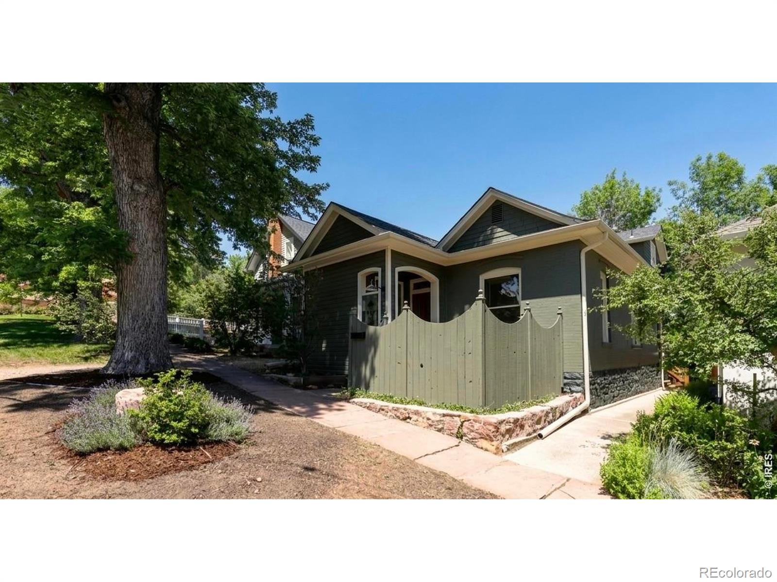 Downtown charm meets modern comfort in this beautifully maintained turn-of-the-century bungalow. Cherished by the same family for more than 40 years, this home showcases timeless character with hardwood floors, 9-foot ceilings, original trim and baseboards, and exposed brick accents throughout.The thoughtfully designed layout includes a private primary suite on the upper level and a spacious family room addition at the rear of the home, providing flexibility for both everyday living and entertaining. Ideally located just minutes from the vibrant Pearl Street district, you'll enjoy easy access to cafes, wine bars, award-winning dining, shopping, the Boulder Creek path, the Farmers Market, and countless downtown amenities.Outside, the fully fenced backyard offers a peaceful retreat with a brick patio, mature landscaping, and privacy fencing. A welcoming front courtyard with a flagstone patio creates additional outdoor living space. A rare bonus is the detached, finished studio complete with a 3/4 bathroom-perfect for a home office, art studio, guest space, fitness room, or creative retreat.A unique opportunity to own a character-filled downtown home in an exceptional location.