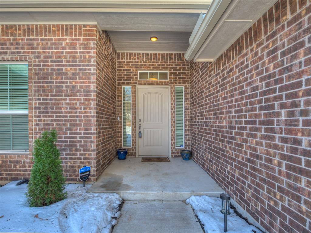 Built in 2021 and situated on 2.21 acres on Hidden Pines Drive, this beautiful rural property offers space, comfort, and modern design. The open-concept living, kitchen, and dining areas feature wood-look tile flooring and create a welcoming layout ideal for everyday living and entertaining. The kitchen is finished with granite countertops, crisp white cabinetry, a built-in microwave, pantry, and plenty of workspace. The spacious primary suite includes a functional ensuite with double vanities, a water closet, separate tub and shower, and a walk-in closet. Two secondary bedrooms share the main bathroom, while the fourth bedroom offers double closets and its own full bath—perfect for guests or a private office space. A nicely sized utility room adds to the home’s practical design. Enjoy outdoor living from the covered back patio on the south side of the home, ideal for cookouts and relaxing evenings. The fenced backyard provides added convenience, while the 3-car garage includes an inground storm shelter. The property is served by OEC Fiber, well water, water softener and an aerobic septic system, offering the benefits of country living with modern amenities. A garden area, chicken coop and run are included on the land outside of the fenced backyard.