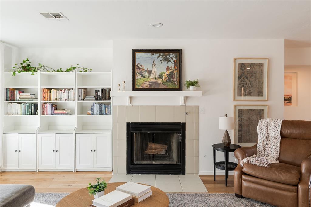 A quaint soft green home rests quietly on 2.5 acres in one of Edmond’s most sought-after pockets. Thoughtful updates have been done throughout the home, including fresh paint and new flooring. The living room is bright and light-filled, with a wall of beautiful windows that let you take in the peacefulness of the land and the trees beyond. A cozy fireplace adds warmth and makes the space feel comfortable and inviting. The kitchen leans into comfort in the best way, with soft green cabinetry and warm wood floors that give off an easy, cozy feel. There’s ample storage for everyday life, and everything feels right where it should be.  The primary suite feels calm and spacious, with an en-suite bath featuring a deep soaking tub, a walk-in shower lined with white subway tile, and a generous closet that completes the space. The second bedroom is quietly set back, with a full bathroom nearby. The home also offers an office that doubles as a third bedroom and a conveniently placed laundry area with a sink and storage closet, practical for everyday life. Through the double doors, a patio opens up for summer evenings spent outdoors, watching the light change across the land. Beyond the home, a large shop(25x35) with electricity offers space to create, store, or tinker, whatever life calls for. Homes like this don’t announce themselves. They’re discovered.