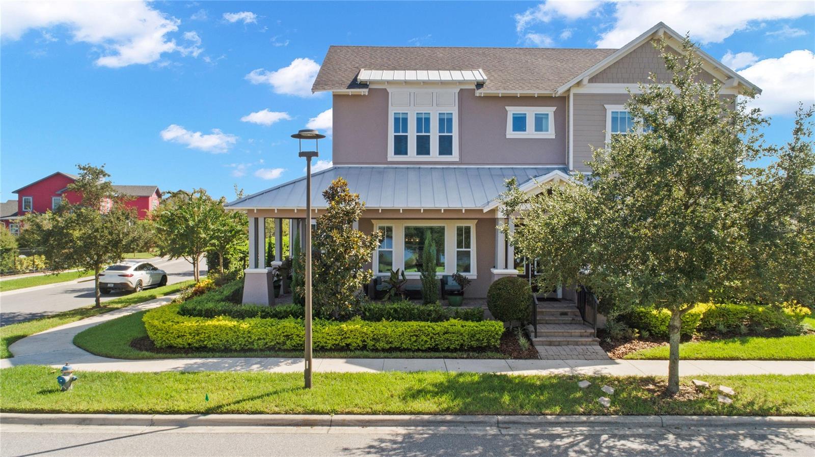 This luxurious estate home in Laureate Park/Lake Nona sits on an oversized corner lot (77 Ft Front) on Square Lake. Enjoy the fantastic views and gorgeous sunsets every day from your own extended covered front porch. Totaling 4,650 square feet with 5 bedrooms and 4.5 baths, this impressive home features so many high-end upgrades that you feel as though you are living in a model home. From the beautiful porcelain tile on the first floor to the extraordinary wood beams in Formal Living, Great Room, Dining Room and Sunroom, you will see the dedication and love put into this home. The gourmet kitchen features two custom islands, double stack kitchen cabinets, gas appliances, double build-in fridge, butler’s pantry with wine cooler, and a large walk-in pantry. Next to the kitchen is a built-in breakfast nook and built-in mudroom. Many areas of the home have been pre-wired for speakers and a Vivint home security system.

The second floor has hardwood floors throughout with the laundry room, 4 bedrooms, and 3 bathrooms upstairs. The spacious primary bedroom features a gorgeous master bathroom and two built out master closets. This home provides multiple options to entertain family and friends - enjoy the views from your large upper terrace or relax in your backyard oasis with covered summer kitchen and a beautiful salt water pool and hot tub along with a pool house/Mother-in-law Suite with full bath. You also have a covered breezeway to a spacious detached 3-car garage.

Enjoy the 44 miles of biking, jogging, and walking trails inside the community and all the amenities Laureate Park - aquatic center, fitness center, community garden, tons of parks and green spaces, Fiber Optics 1 GBPS internet and more.