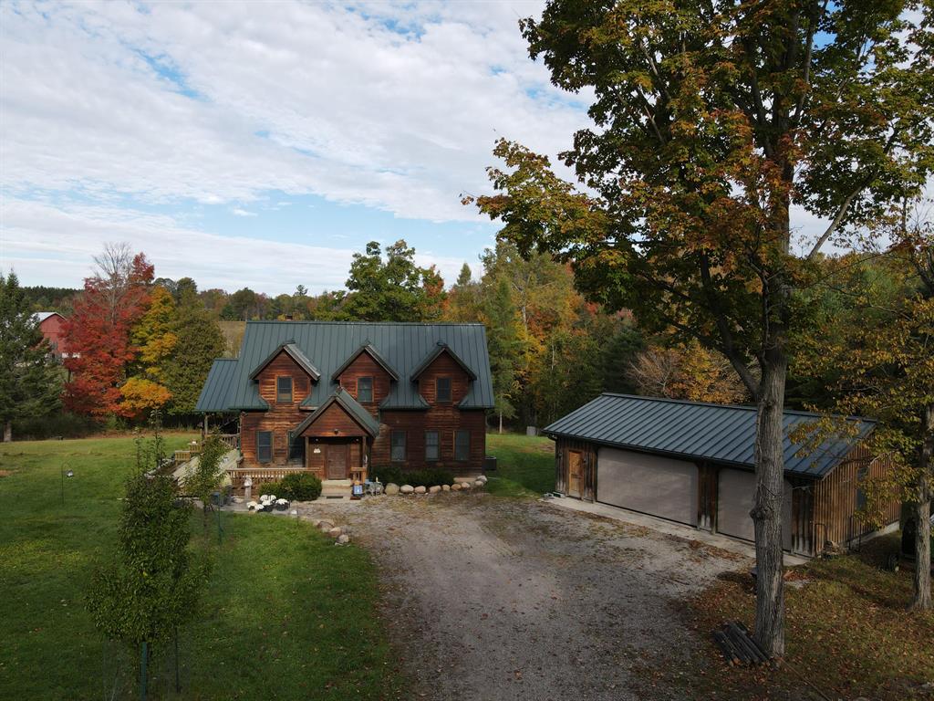 Northeast Michigan seclusion and tranquility! This custom built 6 bed 4 bath home features knotty pine interior, hardwood floors, uniquely tiled showers, 3 fireplaces, huge center island, partial basement, Generac backup generator and wrap around deck. Currently all new decking is be added to most of the deck. Additionally, there is a detached garage with concrete and power. Set nicely off the road on a shared easement, the property once split will be approximately 20 acres and has the Buff Creek flowing through it. The woods consist of mostly maple, poplar and cedar along the creek with a nice opening in the middle that could serve as a great food plot location. Minutes from Jewel Lake that offers fishing and boating opportunities. Sale is subject to final township approval of the land split. Dial the listing agent directly for more information.