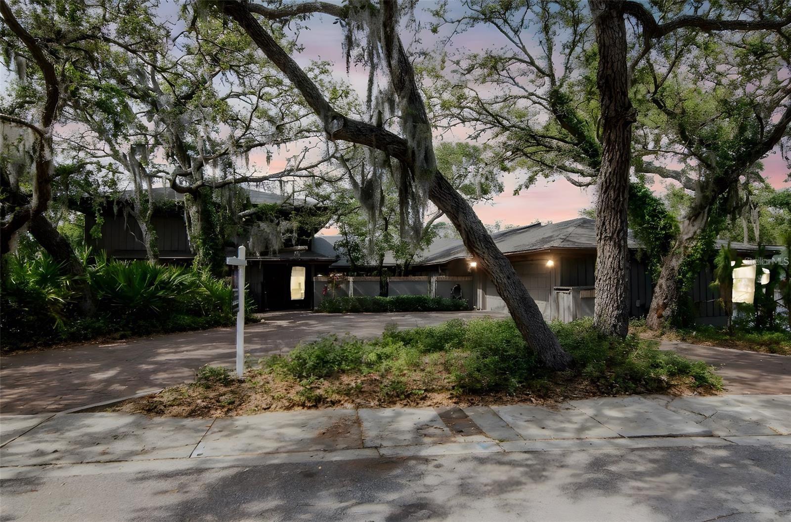 Completely renovated and tucked high into a lush, private riverfront setting, this retreat blends luxury with the raw beauty of Florida. Featuring two master suites, one with its own living/game room, fireplace, and full glass balcony, this home delivers the ultimate in comfort and flexibility.
Inside, you’ll find fireplaces, bright open kitchen, and breathtaking views of the surrounding jungle. Wildlife and birds create a peaceful, everchanging backdrop. The layout flows effortlessly from indoors to out, designed for those who love nature without sacrificing style.
Step into your backyard and launch a kayak straight to the Gulf or gather around the firepit under the stars. This is a rare mix of adventure and serenity.
Built by a builder for his own personal residence, this home was constructed with reinforced metal beams for exceptional structural integrity and lasting protection against severe weather. Located in a naturally elevated and secure zone, water has never entered the home. Surrounded by a living privacy fence of rare, endangered cedar trees planted to promote wellness and support the local ecosystem, the property also features a gentle misting system that cools the air and creates a calming, spa like atmosphere, inviting residents, birds, and native wildlife to enjoy the peaceful setting.
Minutes from Honeymoon Island’s pristine beaches, yet tucked away in total seclusion, this is more than a home, it’s a high end, treehouse, Swiss/Aspen like mountain cabin style escape that feels worlds away from it all.