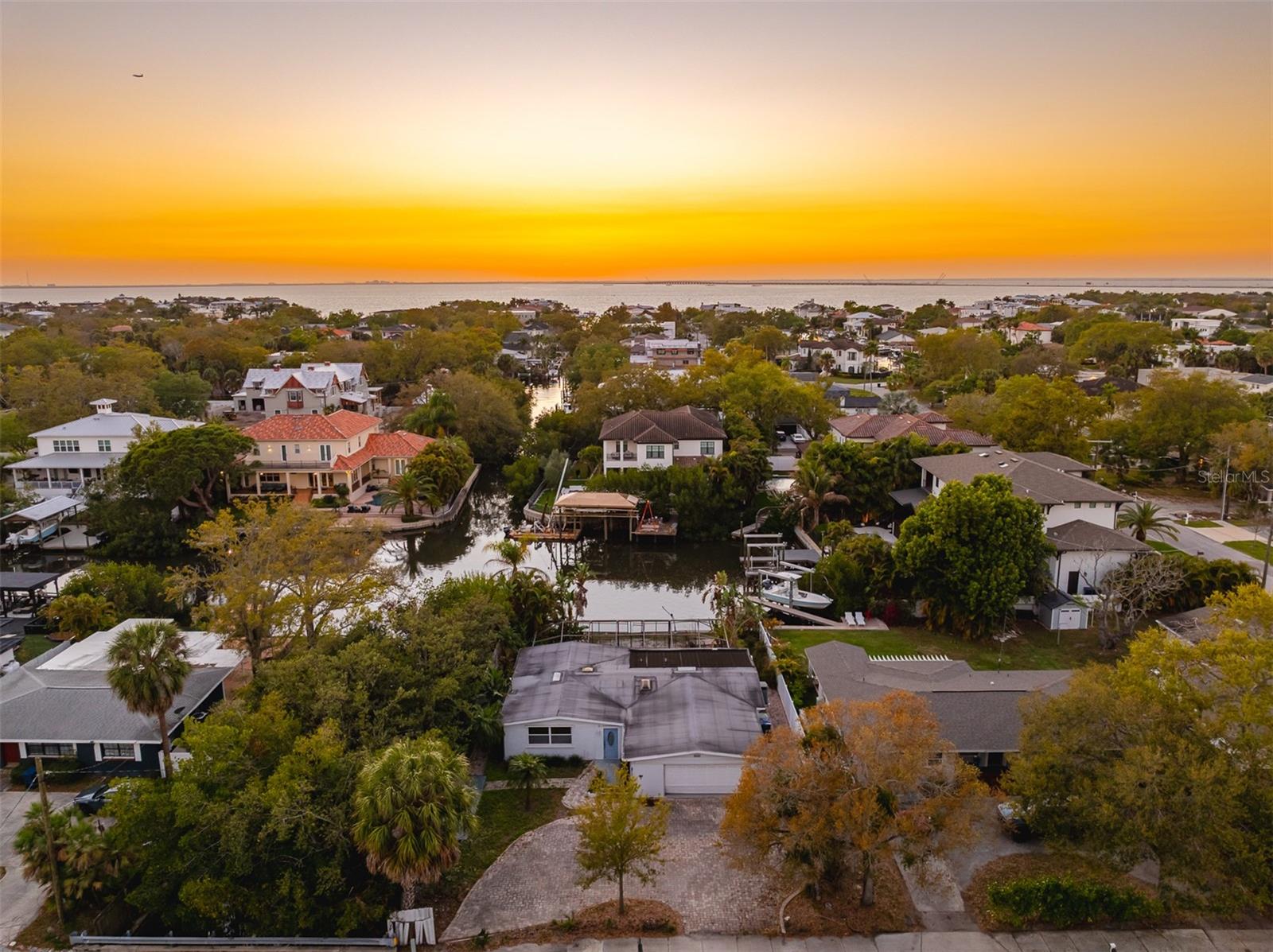 An exceptional waterfront opportunity awaits in the heart of South Tampa, ideally positioned between Culbreath Isles and Sunset Park within the desirable Henderson Beach area. Set along a saltwater canal with direct access to Tampa Bay, this property offers a scenic setting where marine wildlife are often seen and sunsets take center stage from the west-facing backyard. This property includes a private pool and a peaceful water view, creating an ideal backdrop for redevelopment or renovation. Whether restoring the existing residence or building new, the lot and location support strong long-term value. Conveniently located just minutes from International Plaza and Bay Street and within close proximity to Tampa International Airport, this property offers both lifestyle appeal and accessibility. This home experienced flooding from Hurricane Helene in 2024; however, being surrounded by luxury homes and ongoing development, it presents a compelling opportunity to reimagine a waterfront property in one of Tampa’s most sought-after locations.