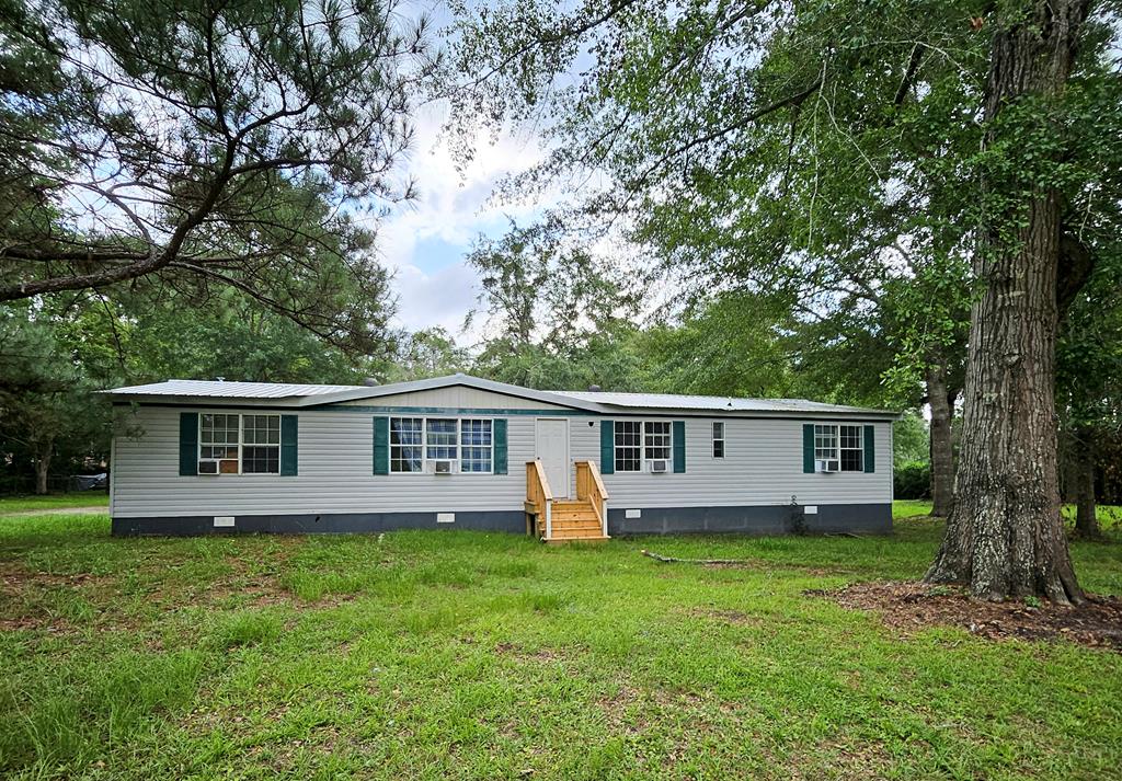 Income- producing opportunity on 3.47 acres! This unique property features two tenant- occupied mobile homes, each offering 3 bedrooms and 2 bathrooms, with a combined rental income of $2500 per month.                              Situated on a spacious 3.47 acre parcel, this property provides immediate cash flow offering multiple possibilities for future growth. Whether you're looking to expand your rental portfolio, live in one home while generating income from the other, or explore future development opportunities, this property offers flexibility and potential. Please do not disturb tenants. Showings will be permitted during the due diligence period only.