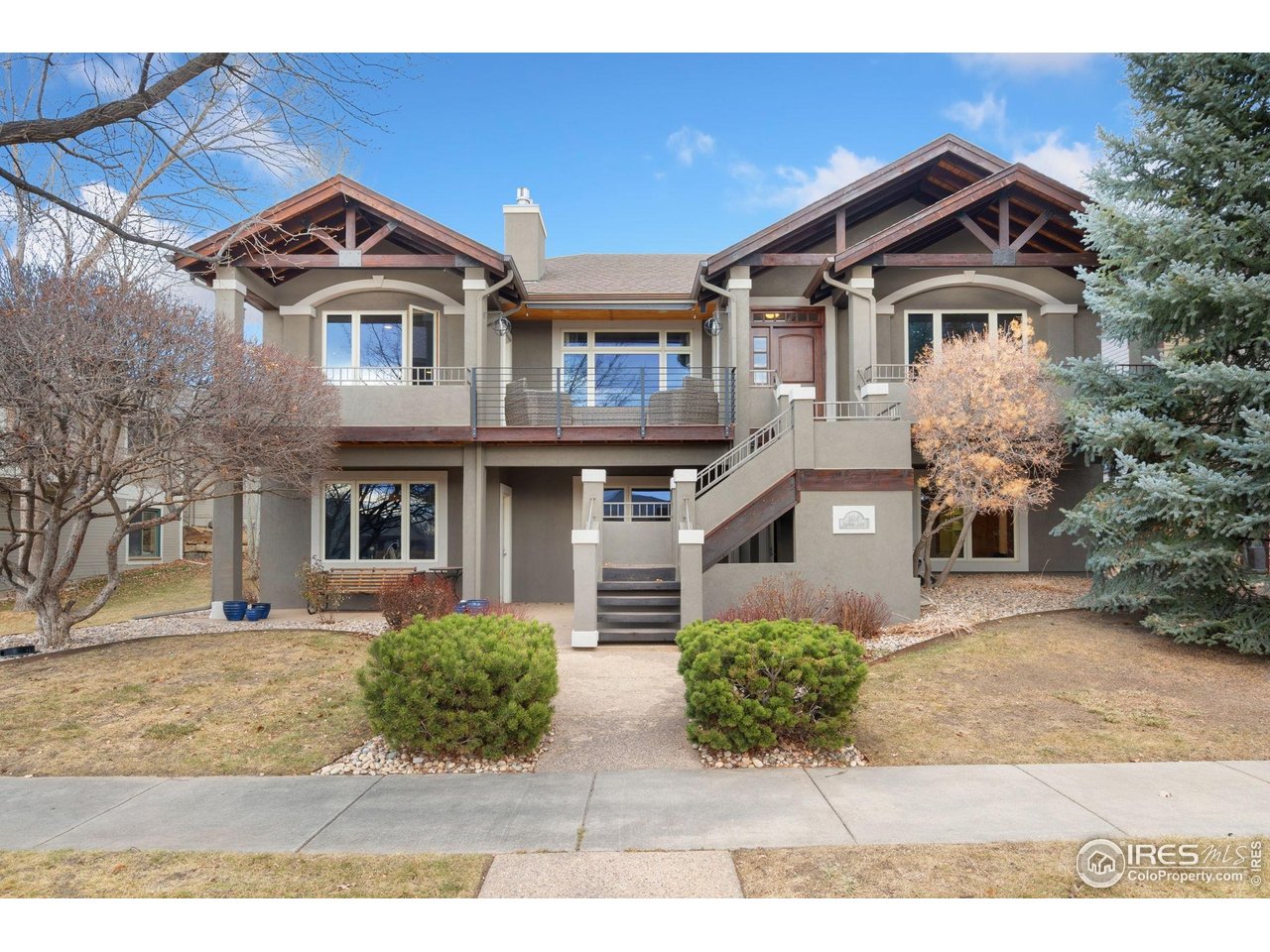 Custom craftsmanship meets timeless Colorado views! Built in 2000 and ideally positioned in Northeast Fort Collins' desirable Hearthfire neighborhood, this exceptional residence offers 3,162 sq ft of purposefully crafted living space with views of Richards Lake and seasonal mountain views. Abundant quality and character throughout, including exposed wood beams, rich American cherry hardwood flooring, and expansive windows that bring the outdoors in. The flexible floor plan features 4 bedrooms, 4 bathrooms, PLUS a dedicated office or optional 5th bedroom, ideal for work-from-home, guests, or multi-generational living. The open-concept design is both welcoming and functional, anchored by two multi-view gas fireplaces that add warmth and ambiance to the main living areas. The kitchen is well-appointed with generous maple cabinetry, granite slab countertops offering ample prep and serving space, and all appliances included for move-in-ready convenience. Designed for easy ownership, the home features a low-maintenance stucco exterior, copper gutters, and composite decking, perfect for relaxing or entertaining while enjoying lake and mountain views. The walk-out basement expands living and entertaining options with seamless access to outdoor spaces and scenic surroundings. Additional highlights include an oversized rear-load 3-car garage, abundant storage, and a setting that blends privacy with proximity to nature. Hearthfire offers a coveted lifestyle with lake access for paddleboarding, kayaking, or fishing, plus a community clubhouse, outdoor pool, and extensive trail system. Enjoy peaceful mornings overlooking the lake, vibrant Colorado sunsets, and the comfort of a well-crafted home in an established community. Just 13 min to Old Town FTC, 16 min to CSU's main campus. Walk or golf-cart to Fort Collins Country Club.