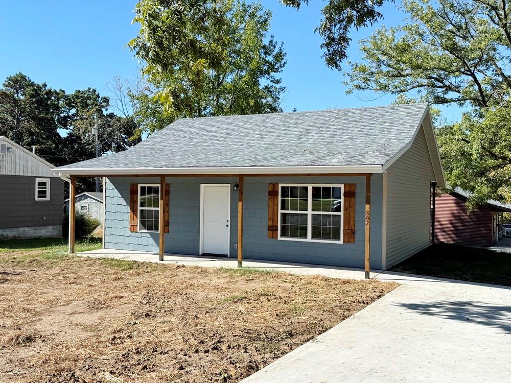New Construction Home For Sale - El Dorado Springs, MO.  
Tired of fixer-uppers? Discover this affordable, low-maintenance new build in the heart of El Dorado Springs - a move-in ready option for buyers seeking simplicity, efficiency, and modern comfort.  This 2-bedroom, 1-bathroom home offers 875 sq ft of well-designed living space. The kitchen features custom cabinets, a pantry, and brand-new appliances including a refrigerator, oven, and built-in microwave - ready for use on day one.  The two bedrooms share a full hall bathroom with a shower-over-tub combo. In addition, a covered back patio provides a comfortable outdoor retreat.  The buyer who puts this home under contract soon will be able to select some colors and finishes, allowing them to customize to their preferences. Estimated completion is January 2026 - now is the perfect time to secure this quality-built home before it's gone.
Photos provided are from a similar home by the same builder; final colors and layout may vary. Call today to schedule a tour or make an offer.