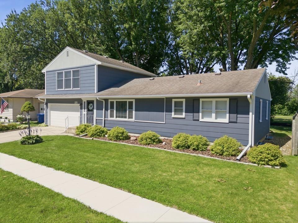 Welcome home to this thoughtfully updated and super-move-in ready 3-bedroom, 1-bathroom home with an attached 2-stall garage and 1,640 square feet of finished living space. Extensive updates have been carefully selected to blend modern comfort with timeless character. The main level welcomes you with a foyer leading into a bright living room featuring a new vinyl replacement picture window. The remodeled kitchen shines with new windows, luxury vinyl flooring, countertops, sink & faucet, recessed lighting, light fixtures, and built-in appliances. The completely renovated bathroom includes a new shower, double-sink vanity with quartz countertop and undermount sinks, updated lighting, and mirrors. Down the hall, three bedrooms offer beautiful hardwood floors, fresh paint, and ceiling fans. The 520-square-foot upper-level great room is a true showstopper featuring exposed wood beams, new carpet, a mini-split, and large expansive windows with both east and west exposures. The property’s private back-yard is developed with stately mature trees, plant beds, landscaped areas and also offers direct access to the Charley Western Recreational Trial. The clean, painted basement provides additional space for storage and future improvements and includes a matching Speed Queen washer/dryer set, and a lower-level shower. With a furnace updated in 2017, a new central air conditioning unit installed in 2026, and numerous updates throughout, this home is ready to impress.