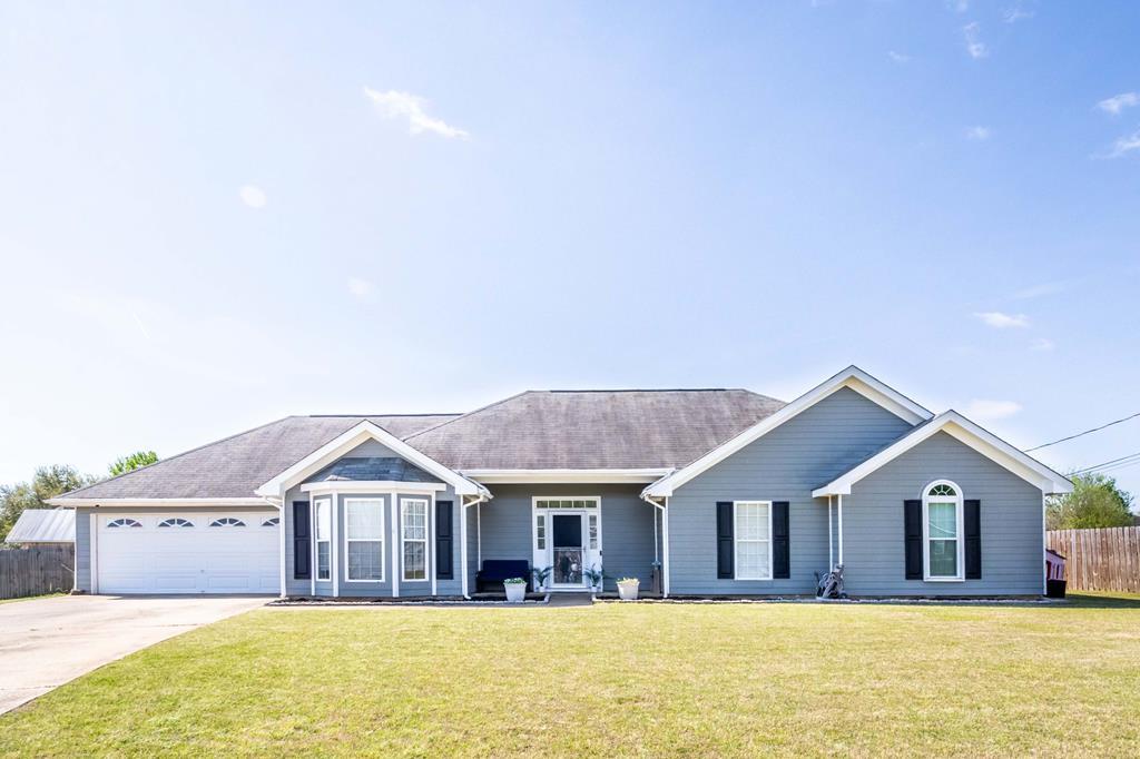 Looking for a countryside retreat without sacrificing a quick commute? This updated one-story home sits tucked away in a cul-de-sac, offering the perfect blend of rural charm and everyday convenience. Surrounded by a mix of residential homes, open farmland, and local small businesses, this property delivers a true escape from the hustle while keeping you just a short, easy drive from the gates of Fort Benning. Inside, single-story living has been elevated with a beautifully remodeled kitchen designed for serious function and style. The space features gorgeous new butcher block countertops, a classic new farmhouse sink, and a sleek suite of brand-new black stainless steel appliances. Just bring your boxes and move right in! Step out back to enjoy the newly added pergola, creating an ideal outdoor living space for morning coffee, evening cookouts, or the perfect shaded spot for your favorite patio plants to thrive.