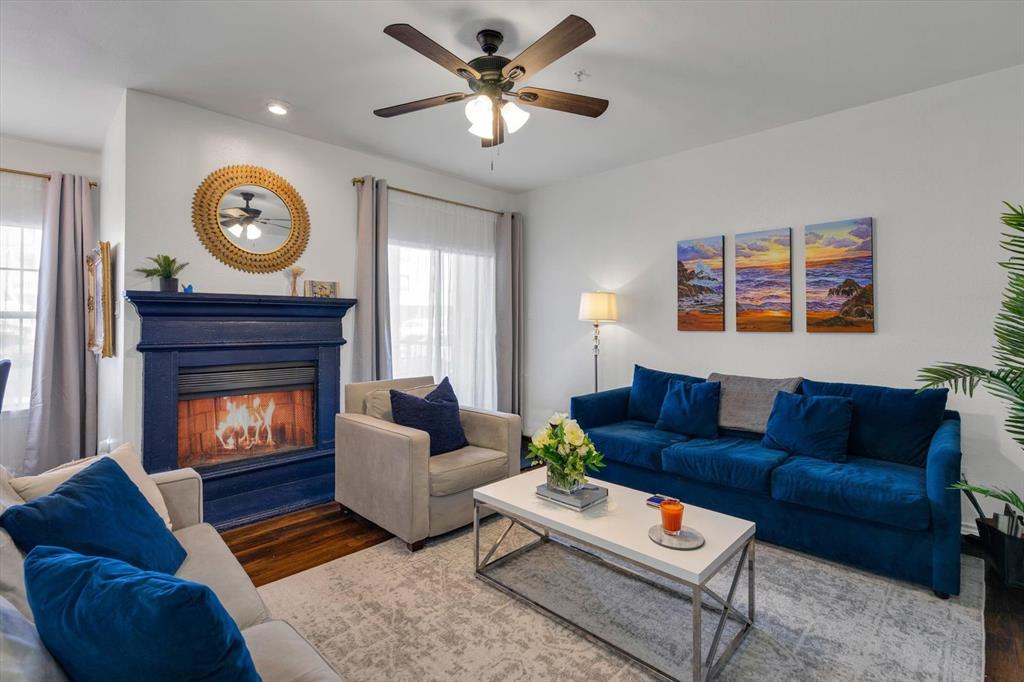 Welcome to this MOVE-IN READY rare first-floor condo offering modern comfort and unbeatable convenience in a prime location zoned for Armstong Elementary in Highland Park ISD! This beautifully designed newly renovated in 2024 2-bedroom, 2.5-bath residence features a highly desirable layout with two spacious bedrooms, each with its own private ensuite bathroom, plus a convenient guest half bath. The open living area is highlighted by a fireplace, stylish wet bar, and large windows that bring in natural light while offering peaceful treed street views. The kitchen features ceramic tile flooring, updated appliances, and a designer sink, creating a clean and modern feel. The primary bedroom includes walls of mirrored closet doors, enhancing both storage and light, while the ensuite bath provides comfort and privacy. Step outside to enjoy the covered patio, perfect for relaxing or entertaining. Additional highlights include two covered parking spaces located near the stairwell, updated lighting, ceramic tile in the kitchen and bathrooms, and thoughtful modern touches throughout. Ideally located within walking distance to SMU, restaurants, and shopping, this home offers both lifestyle and convenience in one of the area’s most sought-after locations.