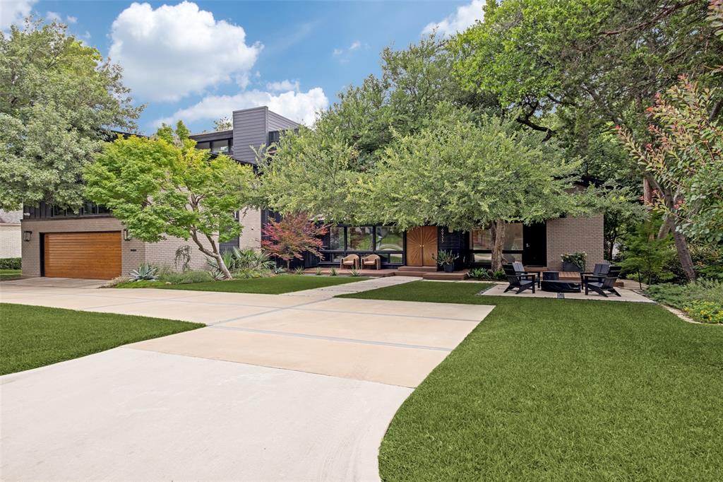Nestled on one of Lakewood’s most private and coveted streets, this iconic four-bedroom Mid-Century Modern home sits on an expansive creek lot surrounded by breathtaking natural beauty. Originally designed by architect David Ludwick and thoughtfully reimagined in a 2017 remodel by Maestri Studio  the home has been meticulously enhanced by the current owners with exceptional attention to detail throughout. Step inside to a stunning sunken living room with fireplace and walls of windows framing serene greenbelt and creek views. The seamless indoor-outdoor connection continues with a spectacular approximately 1,000 sq. ft. engineered deck—perfect for entertaining or enjoying the peaceful setting. The main level features a spacious guest suite with loft, walk-in closet, and fully remodeled ensuite bath. The chef’s kitchen offers a large island, custom cabinetry, high-end appliances, eating area and direct access to the deck. Additional first floor features include a powder bath, laundry room, mudroom, and oversized refurbished with built ins and epoxy floor garage. Upstairs, a split staircase leads to a secondary living area, two bedrooms, and large updated secondary bathroom. The primary suite is an amazing retreat  with treetop views, spa-like bath, abundant storage, and large walk-in closet redesigned by current owner. A three-time Lakewood Home Tour showcase (2017, 2020, 2024) and featured in D Magazine, this exceptional creekside residence blends architectural significance with modern luxury—truly a rare offering in the heart of Lakewood. A list of the extensive updates by the current owner are in doc storage for your review. Enjoy