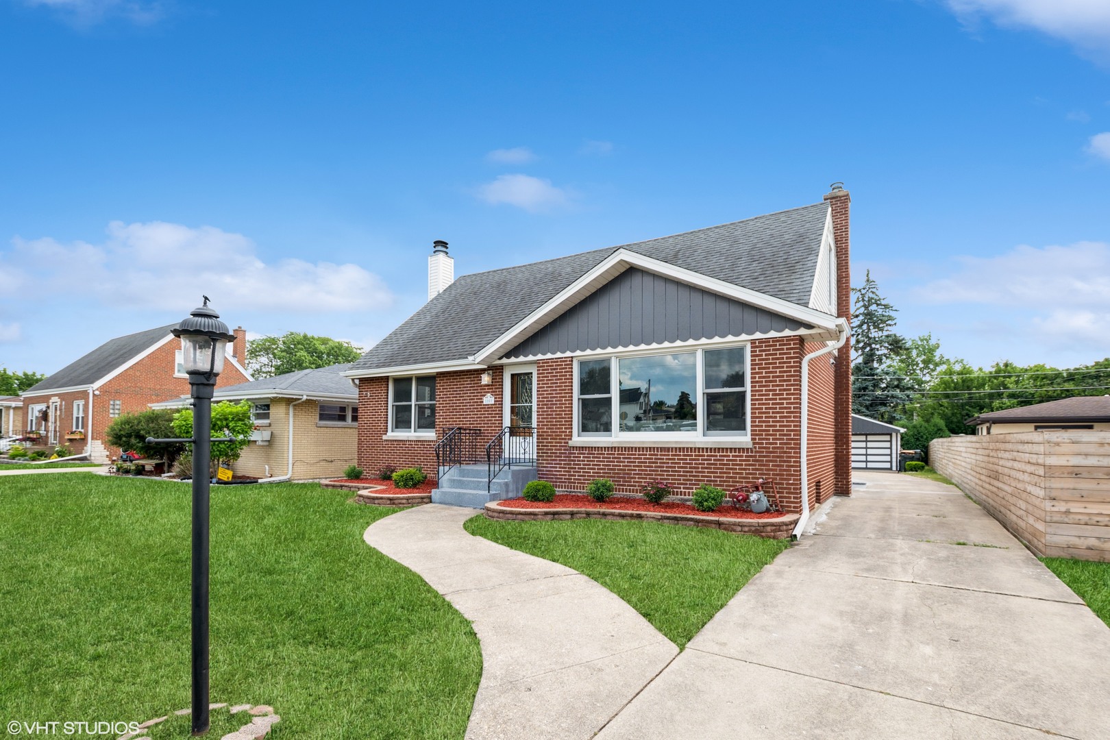 Welcome to your dream home! This completely remodeled 5 bedroom, 3 full bath residence beautifully blends modern elegance with cozy charm. This home is located near the Park Ridge Country Club/Golf Course. Notable updates include a new central A/C condensor (2024), boiler (2017), and water heater (2021), ensuring comfort and peace of mind for years to come. Recently added additional parking spaces next to the garage. As you enter, you will be greeted by an inviting open concept design that showcases luxury vinyl flooring, fresh paint, new trim, new interior panel doors, and stylish fixtures throughout. The spacious living room features a stunning custom designed accent wall and a bay window that fills the space with natural light, creating a warm and welcoming atmosphere. The heart of this home is the brand new eat-in kitchen, a chef's delight that boasts soft-close cabinets, quartz countertops, beautiful backsplash, stainless steel appliances, and Kohler fixtures. The kitchen island has the waterfall design quartz counter, complete with a breakfast bar, is perfect for casual dining and entertaining, making it an ideal gathering spot for family and friends. Adjacent to the kitchen is a charming sun filled sunroom adorned with natural wood walls and ceilings, along with numerous windows that offer serene views and a perfect spot to relax. The main floor also features two generously sized bedrooms, providing ample space for family or guests, and a fully remodeled bath with stylish Kohler fixtures that adds both functionality and elegance. As you venture upstairs, you will discover a large primary bedroom that serves as a true sanctuary, complete with a cozy sitting area and double closets to accommodate all your storage needs. An additional bedroom with 3 closet spaces and a completely remodeled full bath further enhance this private retreat. The walk out basement offers a versatile living space that includes an open family room with recessed can lighting and a refinished fireplace, creating a warm and inviting atmosphere for gatherings or movie nights. This level also features a fifth bedroom, a laundry area complete with a washer and dryer, and a brand new full bath equipped with a luxurious rainfall shower head and Kohler fixtures. Step outside to enjoy the beautifully landscaped exterior, which includes a 2.5-car detached garage and a lovely patio, perfect for entertaining or enjoying quiet evenings under the stars. Don't miss your chance to own this meticulously remodeled home, conveniently located near a golf course, schools, and parks. Schedule your showing today and experience all that this exceptional property has to offer!