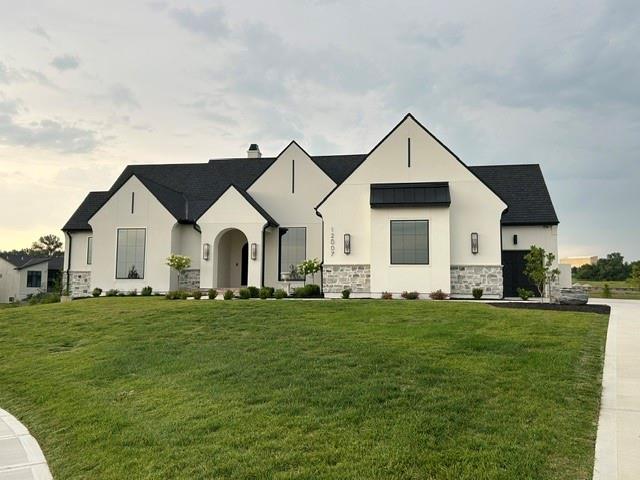 Where timeless European architecture meets today's most advanced luxury living.Positioned on the largest homesite in The Sanctuary, this custom-built Starr Home is a rare blend of timeless architecture, exceptional craftsmanship, and cutting-edge technology. Situated on a private 1 ACRE cul-de-sac estate lot, this Modern European reverse 1.5-story was thoughtfully designed for both luxurious everyday living and unforgettable entertaining.A custom iron arched entry, old-world stone, soaring rooflines, and impeccable landscaping create an unforgettable first impression. Inside, over 5,000 square feet features four bedrooms, four full baths, and two half baths, showcasing European white oak flooring, dramatic archways, custom millwork, vaulted ceilings, designer lighting, and stunning stone accents throughout.The chef's kitchen is anchored by Wolf and Sub-Zero appliances, a striking quartzite island, custom cabinetry, and an impressive scullery with dedicated prep space. The private primary suite offers exposed beams, a floor-to-ceiling stone feature wall, spa-inspired bath with digital shower controls, and an oversized custom walk-in closet.The walkout lower level features 11-foot ceilings, a soundproof theater and Hi-Fi listening room with Atmos surround sound, fitness studio, private guest suite with its own laundry station, and generous entertaining space.Outdoor living rivals the interior with a covered lanai, spectacular sunken courtyard featuring a linear fire feature and 10-foot water wall, custom Hestan outdoor kitchen, wood-burning fire pit, and a backyard already prepped for your future pool. A Crestron Home automation system seamlessly controls lighting, shades, whole-home audio, security, cameras, and Wi-Fi. Every detail reflects an uncompromising commitment to quality, design, and innovation—creating a truly one-of-a-kind luxury estate unlike anything else on the market. Award-Winning Blue Valley School district