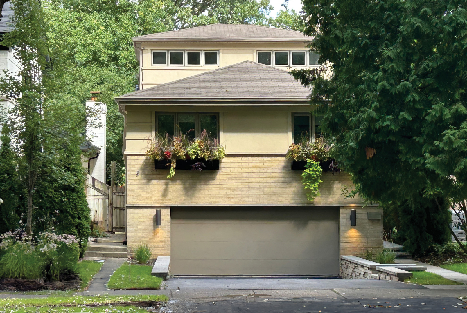 Welcome to this STRIKING Chicago residence with an open floor plan and sun-filled California vibes, offering approximately 3,000 square feet of finished living space in the heart of the desirable Wildwood neighborhood of Forest Glen. Inside, the OPEN, MODERN LAYOUT blends style with livability. Expansive windows flood the home with natural light, while a natural stone fireplace creates an inviting focal point enjoyed from the living, dining, and kitchen areas. The POGGENPOHL kitchen anchors the open-concept space, enhanced by a sleek Dorn BRACHT, FISHER & PAYKEL refrigerator, and premium MIELE appliances-a showcase of both design and performance. From this level, you also have direct access to the ATTACHED GARAGE, adding everyday convenience to the home's striking design.  UPSTAIRS, the primary suite is expansive and serene, with walls of windows, a spacious sitting area, an oversized walk-in closet, and a spa-like bath featuring all KOHLER fixtures, dual vanities, a walk-in shower, and a soaking tub with a dramatic ceiling-mounted DROP FILLER. Three additional bedrooms throughout the home offer generous space for family, guests, or home office needs. On the LOWER LEVEL, you'll find a large recreation room/home theatre and a private office-perfect getaways for quiet work and recuperation. Outdoor living includes a deck overlooking a LARGE, LANDSCAPED BACKYARD. There is more than enough room for hosting large outdoor gatherings, extensive gardening, and play! Set on a tree-lined street in Chicago's WILDWOOD neighborhood of FOREST GLEN, this home enjoys the best of both city and suburban living. Wildwood is known for its low density, large lots, and stately homes. JUST STEPS from the Metra and Caldwell Woods, and only MINUTES to Costco, the Edens & Kennedy Expressways, and O'Hare, the home is also just three blocks from St. Mary of the Woods School and Wildwood Elementary-perfectly situated for everyone's needs!