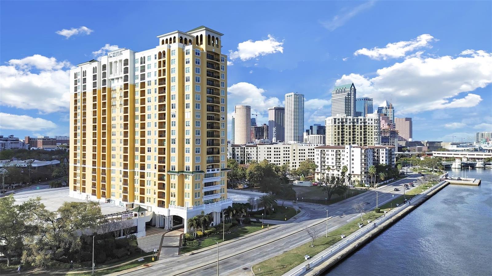 Experience elevated waterfront living in this stunning 20th floor PENTHOUSE residence along world-famous Bayshore Boulevard, just moments from the vibrant energy of Downtown Tampa. This beautifully appointed 2-bedroom, 2-bath split floor plan condominium offers an exceptional blend of privacy, sophistication, and SWEEPING CITY VIEWS. From the moment you enter, the residence welcomes you with refined finishes and an open, airy design. The spacious living area features RICH WOOD FLOORING and flows seamlessly to a PRIVATE BALCONY showcasing breathtaking views, creating the perfect setting for morning coffee, sunset cocktails, or entertaining against the backdrop of the Tampa skyline. The gourmet kitchen is outfitted with newer stainless steel appliances and upgraded finishes, designed to combine style with everyday functionality. Both bedrooms serve as luxurious primary suites, EACH WITH ITS OWN EN-SUITE BATHROOM, generous closet space, and thoughtfully designed layout, ideal for guests, roommates, or dual-primary living. Additional highlights include a 2024 high-efficiency A/C, ensuring year-round comfort while requiring little maintenance. Residents of 345 Bayshore enjoy a resort-inspired lifestyle with an EXCEPTIONAL SUITE OF AMENITIES, including but not limited to: Two fully equipped fitness centers, a TROPICAL OASIS SWIMMING POOL with jacuzzi, outdoor grilling and plenty of space to lounge, front desk concierge service, clubhouse, office center, private conference room, quiet library, and a dedicated dog walk area for pet lovers. This residence also INCLUDES TWO PARKING SPACES (one covered), as well as a locked DEDICATED STORAGE UNIT, providing rare convenience and practicality. Need space for a short term guest? 345 Bayshore offers 2 FULLY FURNISHED LUXURY EFFICIENCIES FOR RENT, available to all owners on a first come, first serve basis. Perfectly positioned along the waterfront, Bayshore Boulevard offers one of the LONGEST CONTINUOUS SIDESWALKS IN THE WORLD for walking, running, and cycling while placing you just minutes from Tampa’s premier dining, entertainment, and cultural destinations. This is Tampa condo living at its finest.