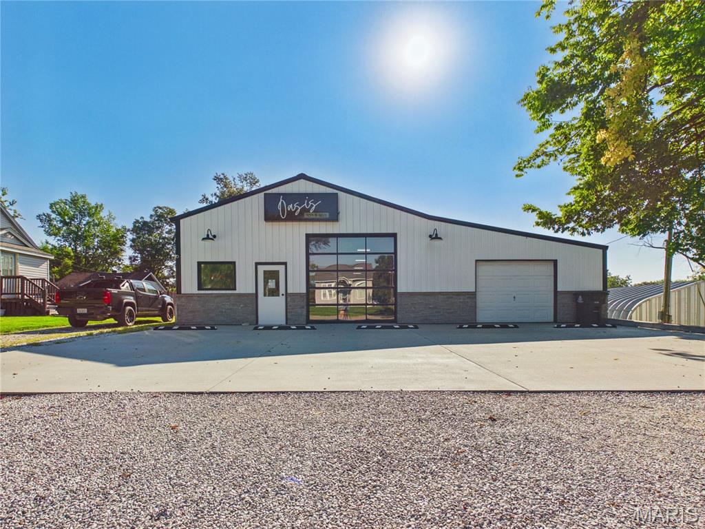Turnkey, versatile, and ready for its next business venture! This commercial space, completely remodeled in 2023, offers over 3,000 square feet of thoughtfully updated space in a high-traffic city location. Once an old warehouse, the property has been transformed into a rustic-modern space featuring beautiful wood, stone, and ceramic tile finishes. Extensive updates include plumbing, HVAC, electrical wiring, a full-view storefront, a 10' x 10' garage door, and a beautifully finished bathroom with a walk-in shower and ceramic tile flooring. A 30' x 47' paved parking area provides convenient customer and employee parking. Currently used as a successful tanning salon, the space offers an excellent opportunity for a variety of businesses, offices, studios, retail concepts, or other commercial uses. With its flexible layout, extensive updates, high visibility, and ample parking, the possibilities are endless. Bring your vision and make this unique commercial property yours!