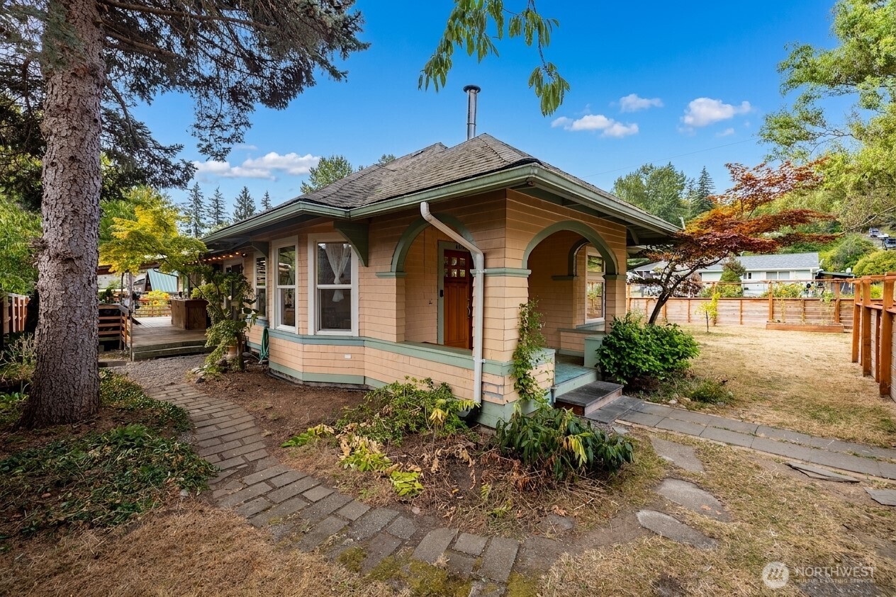 Welcome home to this charming 3 bedroom, 1.75 bath home offering 1,344 sq ft of comfortable single-level living in a fantastic Silver Beach location! Built in 1925, this home blends classic character with thoughtful updates, including a gorgeously remodeled living room and primary bathroom. Gather around the cozy wood-burning fireplace or step outside to enjoy the covered deck and spacious, fully fenced yard that is perfect for entertaining, gardening, pets and play. A garage, dedicated bike & kayak storage, wood shed and RV parking provide plenty of room for all your gear and Pacific Northwest adventures. Enjoy being steps from Lake Whatcom, Silver Beach Elementary, trails, parks and more nearby. This inviting home offers the perfect combination of charm, outdoor space and location.