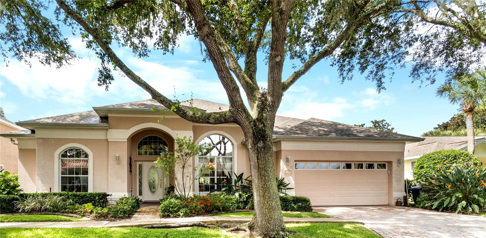 This one level home boasts 2792 square feet, 12 foot ceilings and three spacious bedrooms plus an office and three and half baths.  Each bedroom has a private en-suite bath and walk in closet.  The large kitchen has an island with a cook top, granite counter tops, 42" cabinets plus double ovens.  A large laundry room is convenient to the kitchen with an extra refrigerator and lots of cabinet space.  There are two water heaters, one located in the  primary bath's closet for  quick hot water.  You have a beautiful backyard and view of the 18th tee box of the Jack Nickolas Golf course.  The sun setting view can be spectacular as you look over the golf course. Welcome to one of the prettiest tree lined streets in Grand Haven just one block from the walking/biking esplanade on the Intracoastal. The screened lanai area is over 700 SQ feet with french doors from the living area.   The Bose sound system plays in the lanai.   The Front Street Village is  convenient access to the Village Center and the Creekside Center.   Grand Haven is a gated community offering resort style amenities including a Jack Nickolas Golf Course (for a private membership) plus 2 heated pools,2  fitness centers,7 clay tennis courts, pickleball, walking and biking trails, restaurant and Tiki Hut, and an active social calendar. This home has only been on the market a few days it was active and then was off the market, but now ready to sell!  New HVAC August 2026, Roof 2022, Bosch dishwasher 2024, smoke detectors 2024, refrigerator 2022, Maytag washer and dryer 2024, double ovens 2022, garage door opener  2025,  garbage disposal  2022, Pergo floor in Bedroom 2021.