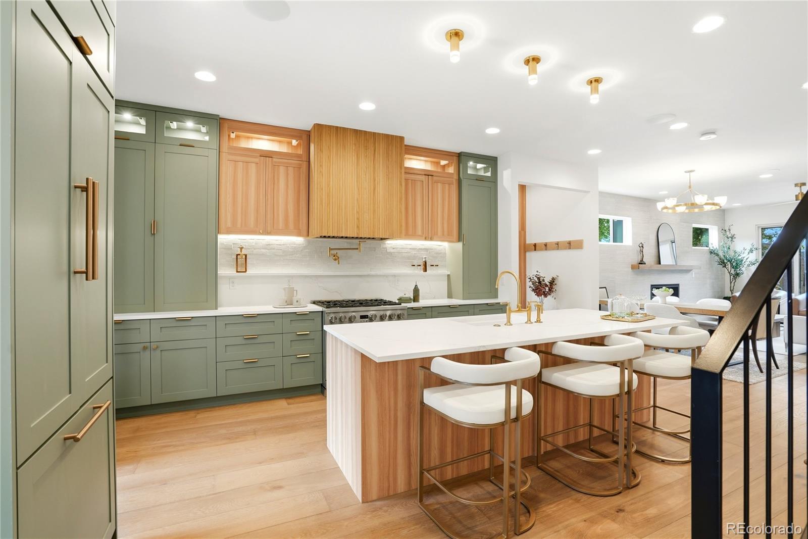 Just 3 blocks from Washington Park, this 2026 new-construction residence offers nearly 4,000 sq ft with 5 bedrooms, 4.5 baths, a private main-floor study, rare private lower level with exterior entrance, loft, rooftop deck, large yard, and extra-height 2-car garage plus parking pad. Thoughtfully designed to live like a luxury single-family home, it features a wide, tall, light-filled floor plan with excellent separation and privacy across all levels. Stair placement on both sides creates a more open, functional flow than a typical residence.Main level features 9.5' ceilings, wide great room with architectural fireplace, chef’s kitchen with 9.5' quartz island, pot filler, professional range, paneled appliances, custom cabinetry, designer tile, dedicated mudroom, private study, and wide-plank hardwood throughout, including the lower level.Lower level features 10' ceilings, wet bar with dining, fireplace, spacious family/theater room, built-in speakers for 7.1 surround sound, setup for a 135-inch projector screen on the large TV wall, ensuite bedroom with wardrobe, dedicated laundry, and private exterior entrance—ideal for guests, multigenerational living, or private work-from-home separation.Primary retreat includes private balcony, custom built-in dressing closet, and spa 5-piece bath with LED-lit makeup mirrors. Top-floor bedroom with panoramic views. Loft with wet bar opens to a large rooftop deck with views. Set on a 3,550 sq ft lot with a large yard, extra-height 2-car garage, and parking pad. Additional features include dual HVAC, dual laundry, smart-home integration, built-in audio, security cameras, iPad control, enhanced insulation, energy-recovery ventilation, and performance-tested construction exceeding typical new-construction expectations.Walk to WashPark, neighborhood shops and Broadway. 5 min to Cherry Creek.  Home will be listed on 5/19