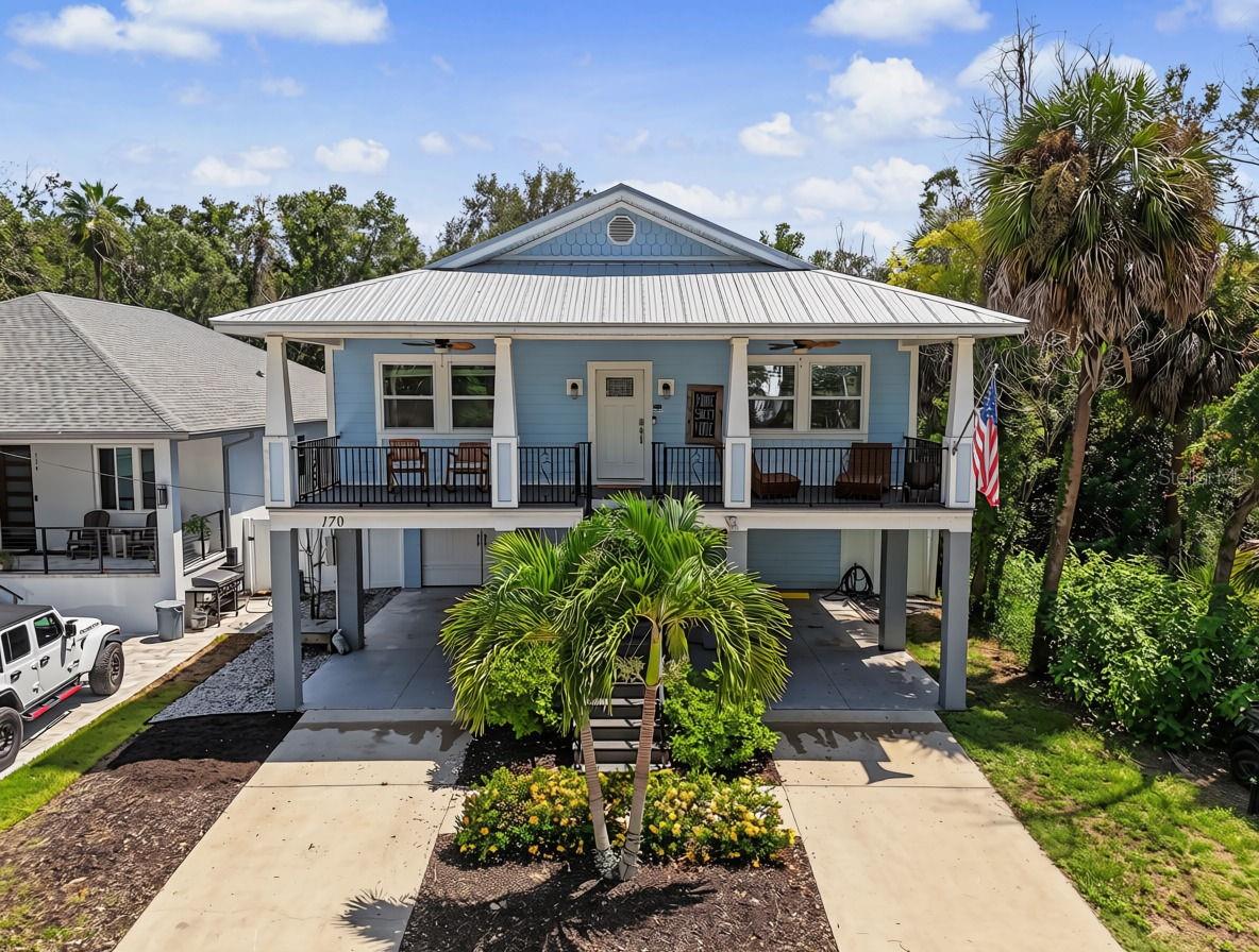 Elevated, nearly new construction in the heart of Tarpon Springs — this 3-bedroom, 2-bathroom coastal home was built just 6 years ago and thoughtfully raised above the flood zone, offering peace of mind that older homes in the area simply can't match. From the moment you step inside, you'll notice the modern finishes, open layout, and quality craftsmanship of a home built to current Florida code — engineered for durability, energy efficiency, and long-term insurability.The main living level features an open-concept design that flows effortlessly to a spacious covered balcony — the perfect spot to enjoy your morning coffee, entertain guests, or unwind with Florida's signature Gulf breezes.Below the elevated main floor, you'll find a fully finished efficiency unit with its own private entrance and full kitchenette — a rare bonus space that adds tremendous versatility to the property. While not counted in the home's official living area due to its location within the flood zone, this space has been successfully used as a private guest suite and rental unit, generating meaningful supplemental income for the current owners. Ideal for extended family, visiting guests, a home office, or continued rental use.Located just minutes from historic downtown Tarpon Springs, the world-famous Sponge Docks, Fred Howard Park, Sunset Beach, and the Pinellas Trail, this property offers the best of Florida's Gulf Coast lifestyle — walkable, laid-back, and full of charm. Whether you're looking for a full-time residence, seasonal retreat, or an income-producing opportunity, 170 East Spruce Street delivers modern peace of mind in one of Tarpon Springs' most desirable neighborhoods.