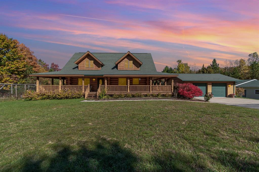 A NATURE LOVER"S AND HUNTER"S PARADISE! Custom built 2-story home with wraparound porch on 20 acres bordering Huron National Forest. 3 bedrooms, 2.5 bath, and fully finished walkout basement for over 3200 SQ. FT. living space. Main floor: wide hallway entry with 1/2 bath, primary suite with full bath, laundry room, and open concept kitchen/dining/living room. Upstairs: 2 generous sized bedrooms, full bathroom, extra-large open loft area. Well maintained hardwood floors throughout. Fully finished, open, walk-out basement with large storage room. The property boasts an orchard, a large established garden, 28x28 2car garage with drain, and an insulated deer blind. Whole-house generator, new in 2022. Asphalt driveway 20x86 steel pole barn with separate workshop, storage area, and RV garage all with power and lights. The workshop is insulated with wood burning stove and cement floor. Extra large storage area with cement floor, built-in floor to ceiling shelves, and sliding barn door for all your outdoor toys and equipment. RV garage has tall garage door with electric opener. Whether it's your new family home or luxury hunting lodge property, you are just 5 minutes to Hale, 30 minutes to West Branch or Tawas.