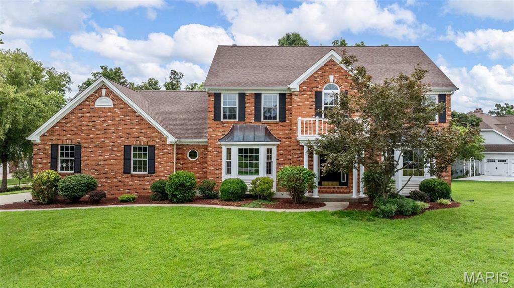 LAKEVIEW! Welcome to this beautifully maintained 4BR 2.5BTH 2sty home offering 4400+ sqft of living space nestled on a .45 acre lot w/ a WATER VIEW in highly sought after Lake St Louis. From the moment you arrive you'll be impressed by the homes classic brick front, lush landscaping w/irrigation sys & oversized side-entry 3 car garage. Step inside to the find gleaming HW floors & an elegant layout w/a formal dining rm on one side & living rm on the other flowing seamlessly into the great rm w/a cozy FP & LG bay window. The kitchen offers plenty of space to gather & cook featuring a center island w/bkft bar, walk-in pantry, SS appliances, ample cabinetry & workspace for everyday needs & opens to the light-filled bkft rm w/ LG bay window w/door to the expansive deck offering a serene water view perfect for morning coffee or outdoor dining. A ML laundry rm & powder rm add everyday convenience.  Upstairs you'll find all four BR including a spacious primary suite w/french door entry, vaulted ceilings, walk in closet & updated spa like bth w/dbl sink vanity, soaking tub & sep shower. A sitting rm & add'l updated full bth finish the upper lvl. The partially finished LL provides a rec rm, den & exercise rm perfect for entertaining or relaxing. Enjoy ALL LSL amenities including 2 lakes, clubhouse w/restaurant & bar, pool, golf & tennis. Great location w/easy access to major hwys & AAA Wentzville School District. This MOVE-IN-READY homes combines comfort, space & location. A MUST SEE!