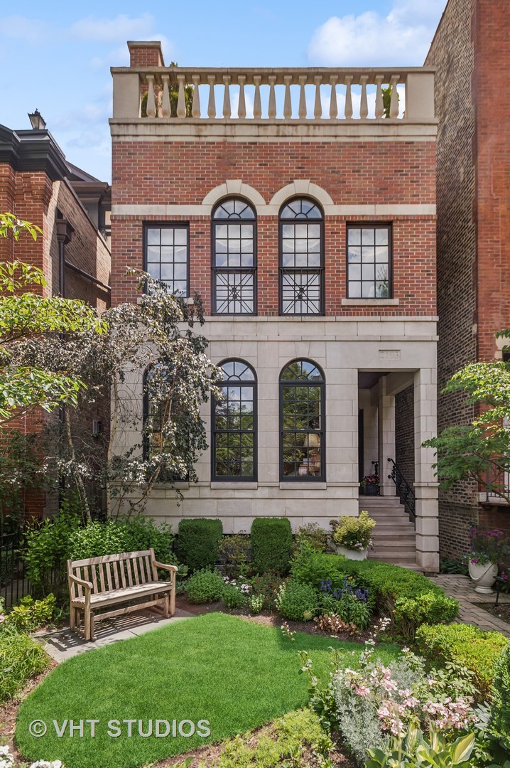 Nestled on one of Lincoln Park's most desirable blocks, this brick and limestone facade 5 bedroom l 4.2 bath residence, blends classic sophistication with modern living. The main floor showcases an elegant living room with arched windows, custom millwork, and fireplace opening into the formal dining room. The chef's kitchen is equipped with professional-grade appliances, custom cabinetry, breakfast area, custom desk and butler pantry opens seamlessly into the inviting family room with gas-starter fireplace and coffered ceiling. Second floor features an impressive primary suite with generous walk-in closet, custom built-ins, and spa-inspired bath and two additional bedrooms with hall bath. The top floor showcases a penthouse recreation room, handsomely-appointed home office/bedroom, full bath and two private rooftop decks. Lower level enjoys a spacious recreation room with custom built-ins, large guest bedroom with ensuite bath and abundant storage. Outdoor living shines with private patio, built-in gas grill and fabulous sport court above the garage - an inviting oasis to unwind or host friends. Walking distance to all that Armitage Avenue has to offer and just steps to Oscar Mayer School and Trebes Park. Experience the very best in urban living!