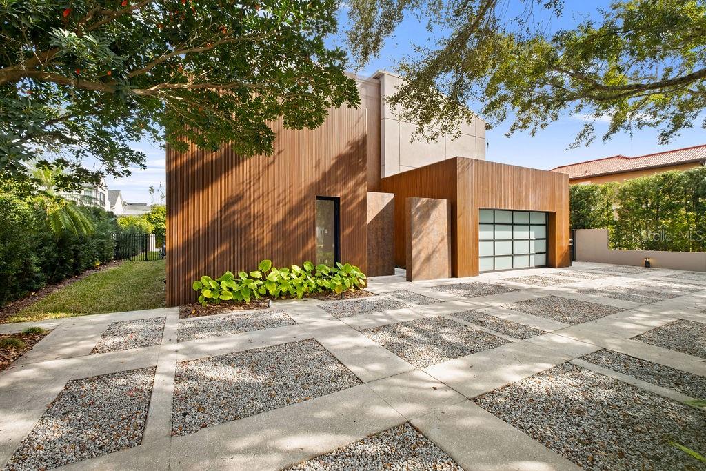 A New Standard of Modern Sophistication in Winter ParkIn a city known for its heritage, this ground-up architectural renovation emerges as a bold statement of modern luxury. Located within one of Winter Park’s most coveted enclaves, this four-bedroom, five-bathroom residence is not merely a place to live, but a meticulously crafted experience where high-design meets intuitive living.Step through the striking 10-foot glass pivot doors into a world defined by light and scale. The soaring foyer gives way to an expansive open-concept floor plan, where the boundary between indoors and out begins to blur. Sleek Italian wood flooring guides you through the main level to the heart of the home: a grand living area anchored by a statement fireplace. It is a space designed for the quiet morning coffee just as much as the vibrant evening gala.A Symphony of Intelligence. This home lives and breathes with you. Equipped with a fully integrated Control4 automation system, the environment responds to your touch. From your device, you can orchestrate the perfect atmosphere—adjusting custom lighting scenes, streaming high-fidelity music, or setting the climate before you even arrive. This "invisible concierge" extends to the water’s edge, allowing you to manage pool temperatures and lighting with effortless precision.The kitchen is a masterclass in culinary elegance, blending European minimalism with professional-grade power. Light-toned cabinetry hides clever storage solutions, while premium Sub-Zero and Wolf appliances sit beneath striking Neolith double countertops. It is a space that invites creativity, whether you are hosting an intimate chef-led dinner or enjoying a slow Sunday brunch.The commitment to "pride of ownership" is felt most deeply in the private quarters. Each of the four bedrooms is a dedicated en suite retreat, featuring voluminous walk-in closets and spa-inspired baths. Custom vanities, Neolith surfaces, and soft, indirect lighting create a hotel-level sense of calm, ensuring every guest or family member feels a sense of total seclusion.The Backyard Resort. The transition to the outdoors is seamless, revealing a private oasis designed for the quintessential Florida lifestyle. A Brazilian IPE wood deck surrounds a shimmering, heated mini-pebble pool in French gray. Beyond the water, the lushly landscaped grounds lead to a premier summer kitchen clad in sintered stone. Here, under the Florida stars, the integrated grill and sink provide the ultimate setting for al-fresco entertaining.Experience the pinnacle of Winter Park living. You are situated just moments from the refined energy of Park Avenue, the prestigious Interlachen Country Club, and the scenic beauty of Phelps Park. With zoning for the area’s top-rated schools the location is as strategic as it is beautiful.Notable Refinements:• Whole-home generator ensuring absolute peace of mind.• Finished garage floors and a circular driveway accented with salt and pepper gravel.• Full-home Control4 integration for music, light, and climate.Experience the art of living well—connect with us today for an exclusive private tour**Unique financial opportunities available: The seller is open to owner financing and Bitcoin (Digital Asset/ Crypto) as a medium of exchange. Please reach out to discuss how we can facilitate a transaction tailored to your needs.**