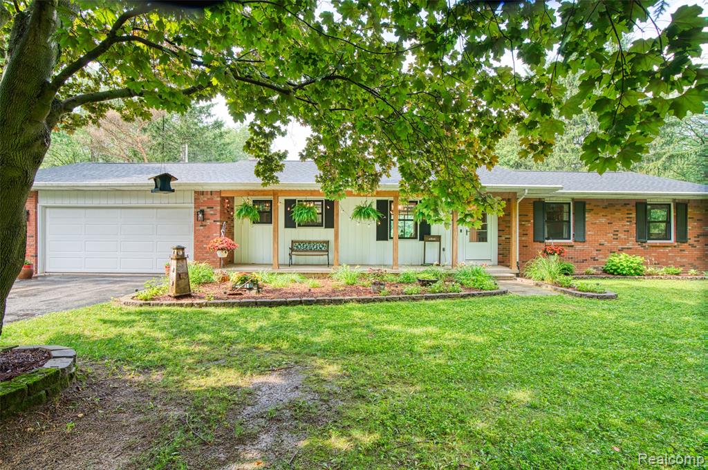 Calling all outdoor enthusiasts! This private, updated ranch sits tucked back off the road on just over 13 beautiful acres — the perfect blend of open space and wooded serenity. Located approximately 18 miles from downtown Lansing and only 5 miles from I-69, this property offers both privacy and convenience. Enjoy summer gatherings on the newly built deck (2022) or relax year-round in the hot tub located in the inviting three-seasons room. An oversized shed provides plenty of space for all your yard tools and outdoor gear. Inside, you’ll find a bright and welcoming home filled with updates, including new flooring, trim, carpet, paint, and light fixtures throughout. The kitchen features stainless steel appliances, a new sink (2025), and modern fixtures and flooring. The stove with convection oven and sink are brand new in 2025, while the fridge and dishwasher are only 5 years old. Both bathrooms have been tastefully updated with modern vanities and fixtures. Enjoy peace of mind with major system updates including Furnace and AC/Heat Pump (2021) – with transferable warranty, New sump pump (2023), Roof replaced (2019), Generator plug for added security during power outages. Abundant natural light fills the kitchen, dining, and living areas through the brand-new, black-framed windows, offering stunning views in every direction. The unfinished basement provides excellent potential for future living or entertaining space. Located in the Bath school district, with school of choice available at Laingsburg Schools, this home is efficient, updated, and truly move-in ready. Septic pumped June 2025. Whether you’re looking for peaceful country living, room to explore, or the perfect setup for outdoor recreation — this property has it all.