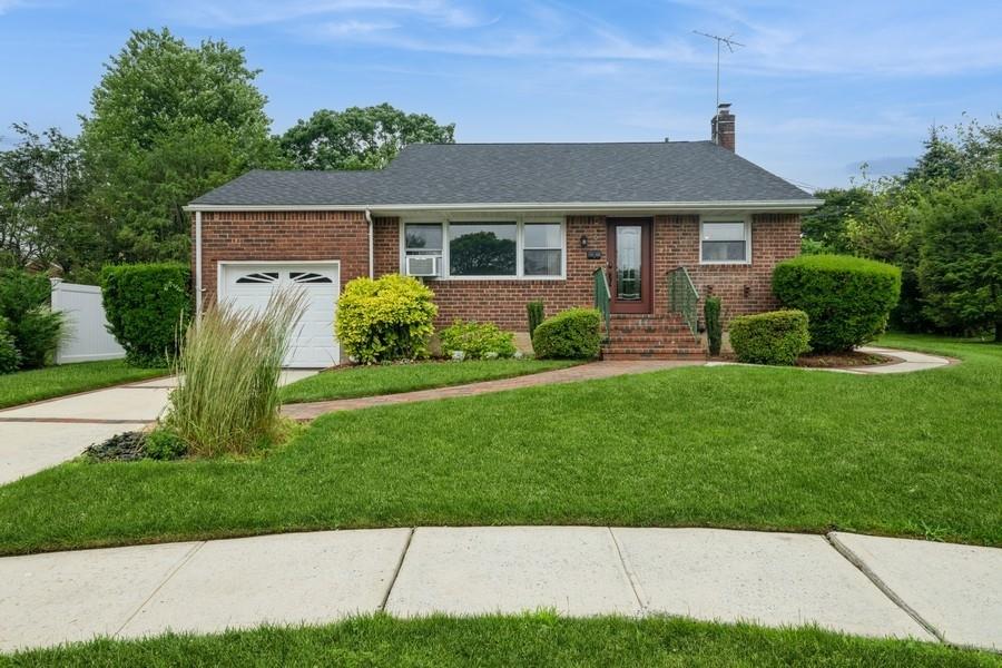 Welcome to 6 Robert Court - a beautifully maintained and character-rich home nestled in a quiet cul-de-sac in the heart of Bethpage. With a brand new, 1-month-old roof and gorgeous hardwood floors throughout, this home is truly move-in ready and brimming with potential.
It has 3 spacious bedrooms, two full bathrooms, with a den that is perfect as a home office, extra bedroom, private studio setup or even great accommodations for your guests. The extra large attic and attached garage offer convenience and lots of storage space. Oil heat with gas cooking.
A backyard unlike any other. Step outside into this picturesque outdoor space made for entertaining, gardening, recreation or simply relaxing in your own private retreat. This home is close to all local schools and has convenient access to shopping, parks, restaurants and commuter routes with proximity to world-renowned golf courses.
Don't miss the opportunity to own this unique and versatile home in one of Long Island's most sought after areas.