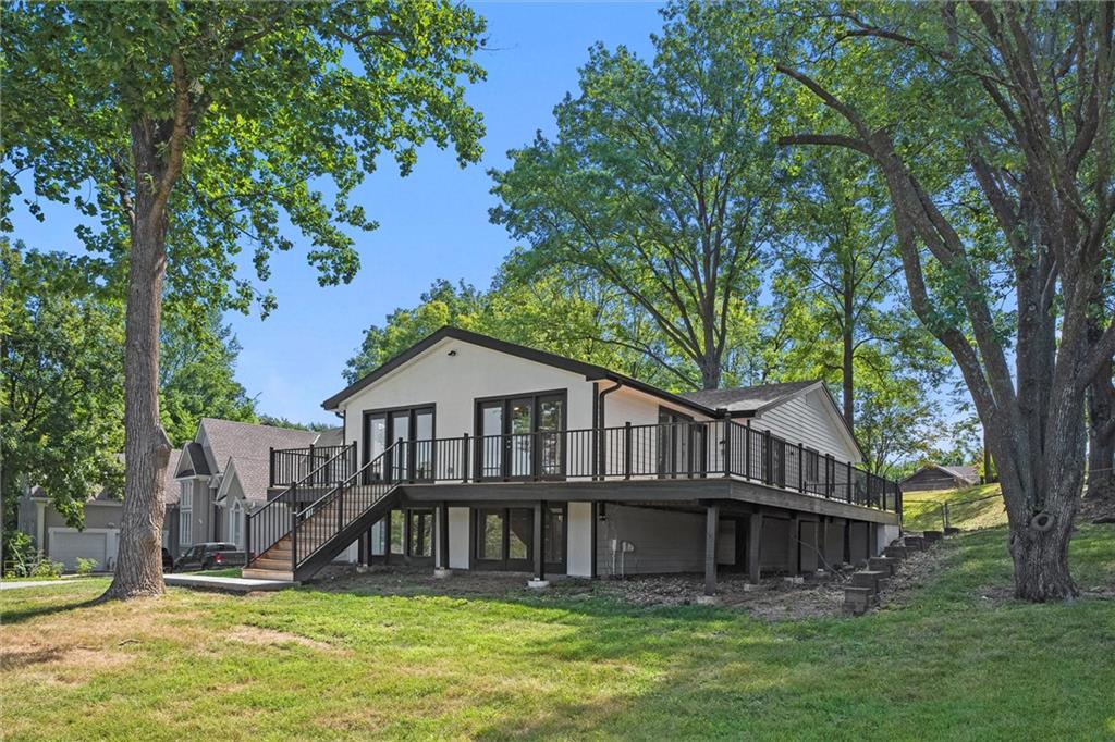 Amazing updated Raised Ranch in Weatherby Lake! This home sits on 1/2-acre lot and features a new kitchen, updated baths, new flooring, exterior upgrades, and more. Enjoy stunning lake views from the expansive new deck and take advantage of its location within walking distance to the community’s amenities point access area, complete with a swim beach, picnic tables, pavilion, and more. The main level boasts vaulted ceilings and large picture windows, flooding the space with natural light. It includes a formal dining room, a primary suite, an additional bedroom and bathroom, plus a convenient laundry room. The lower level offers a cozy family room and two more bedrooms with a Jack-and-Jill bathroom. The oversized garage is a bonus. Embrace the Lake Lifestyle, with immediate access to swimming, fishing, community clubs, playgrounds, and so much more. Experience the magic of Lake Life and make this home yours TODAY!